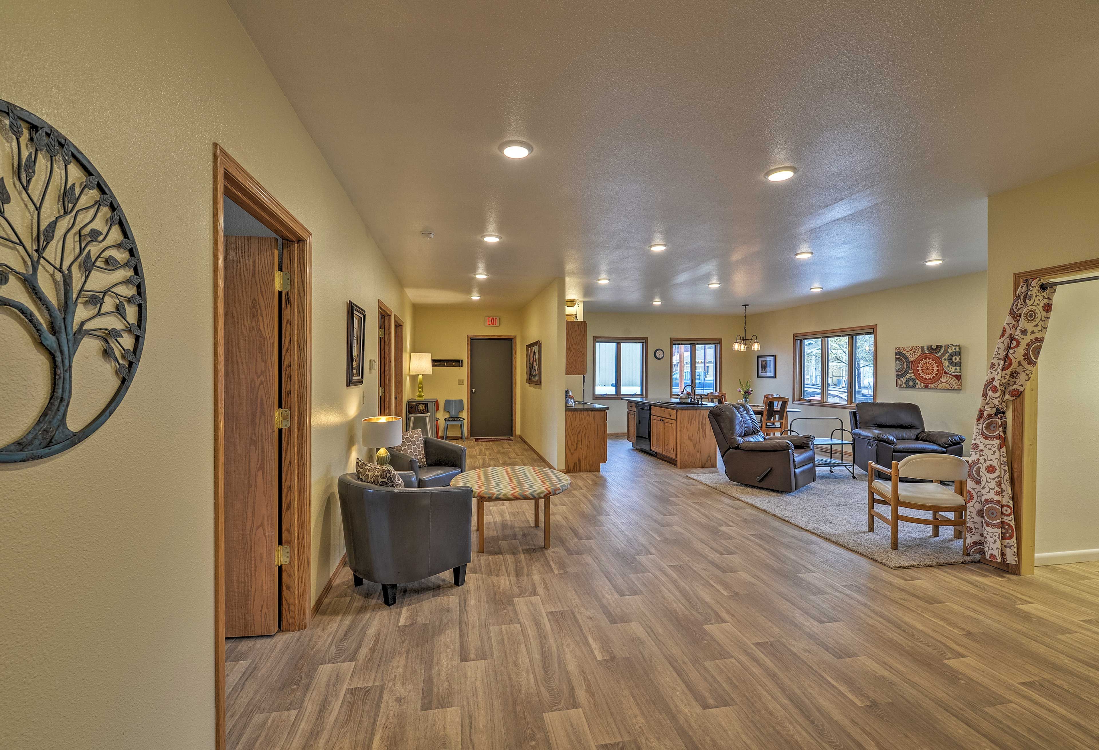 Brand-new hardwood flooring leads throughout the spacious living area.