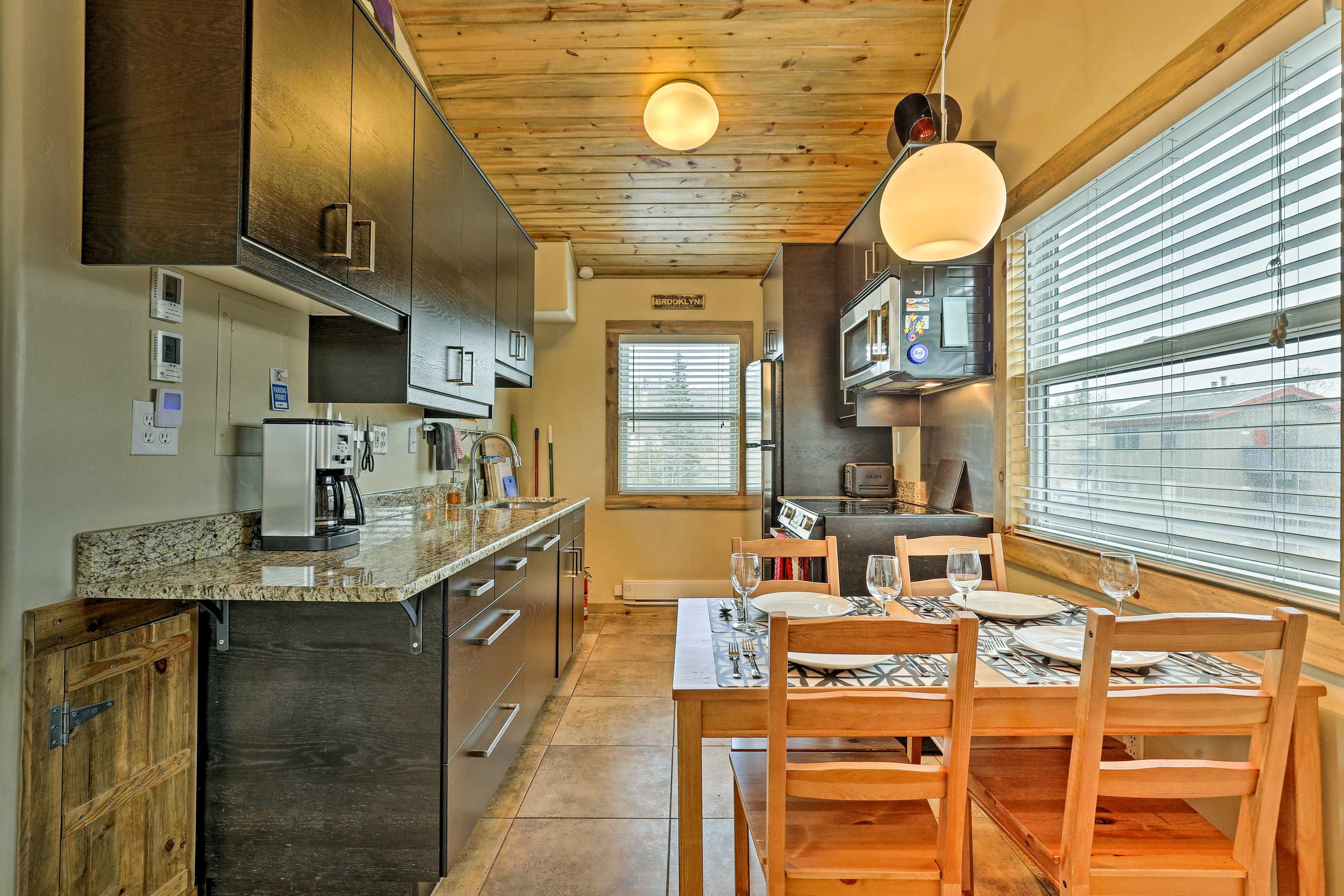 The well-equipped kitchen boasts stainless steel appliances.