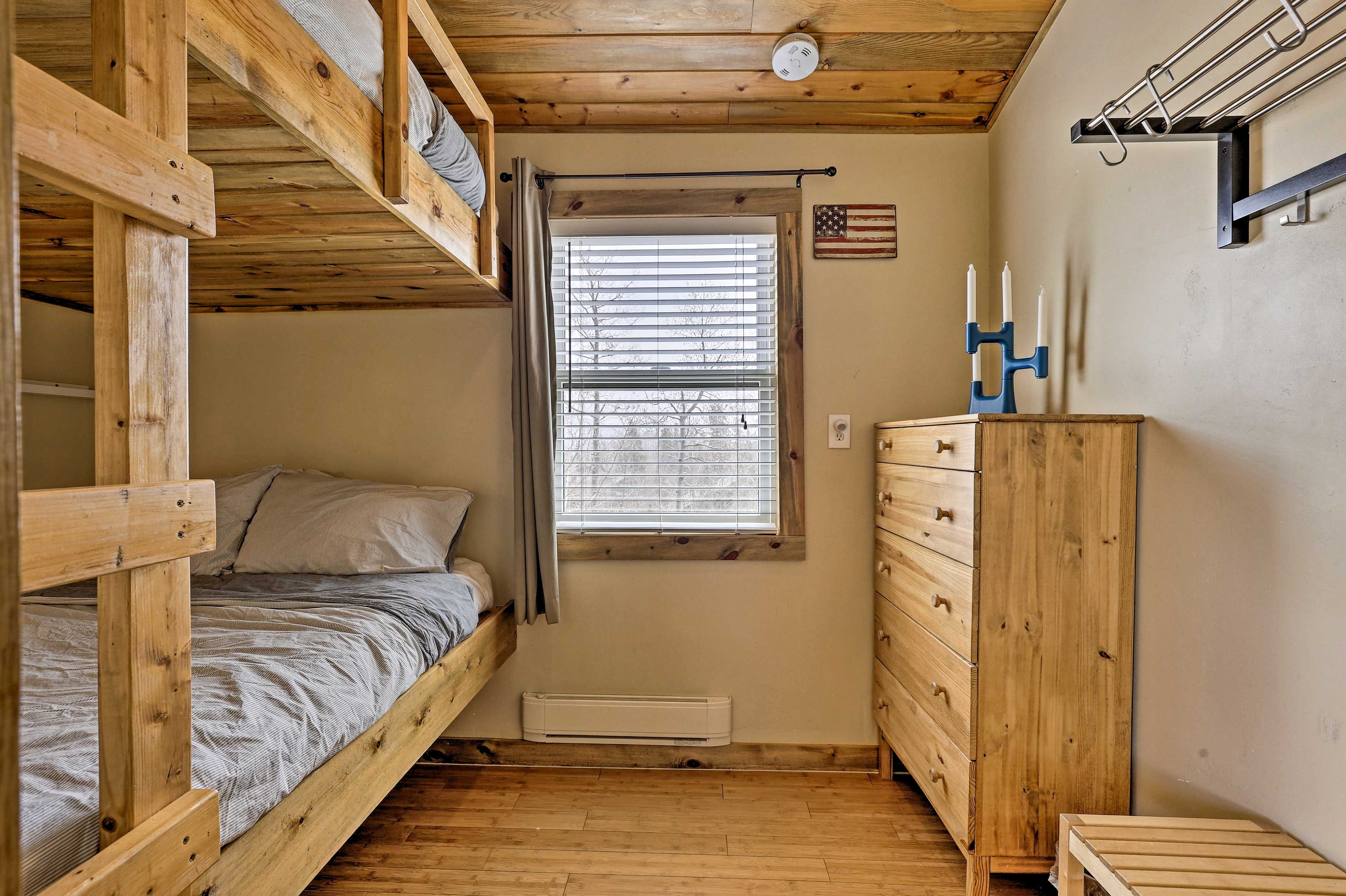 This bedroom boasts built in bunk beds.