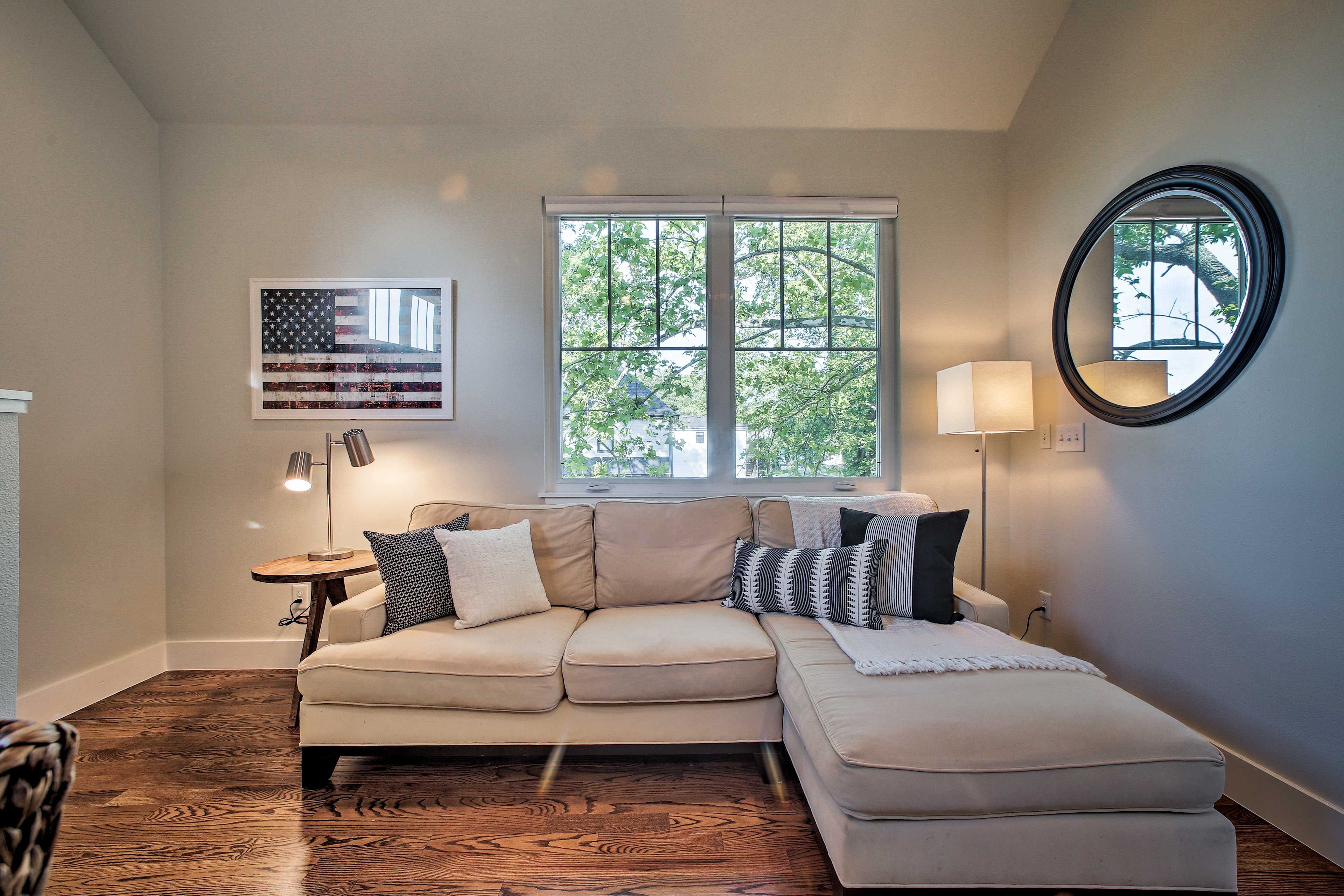 Picture windows allow natural light to flood in.