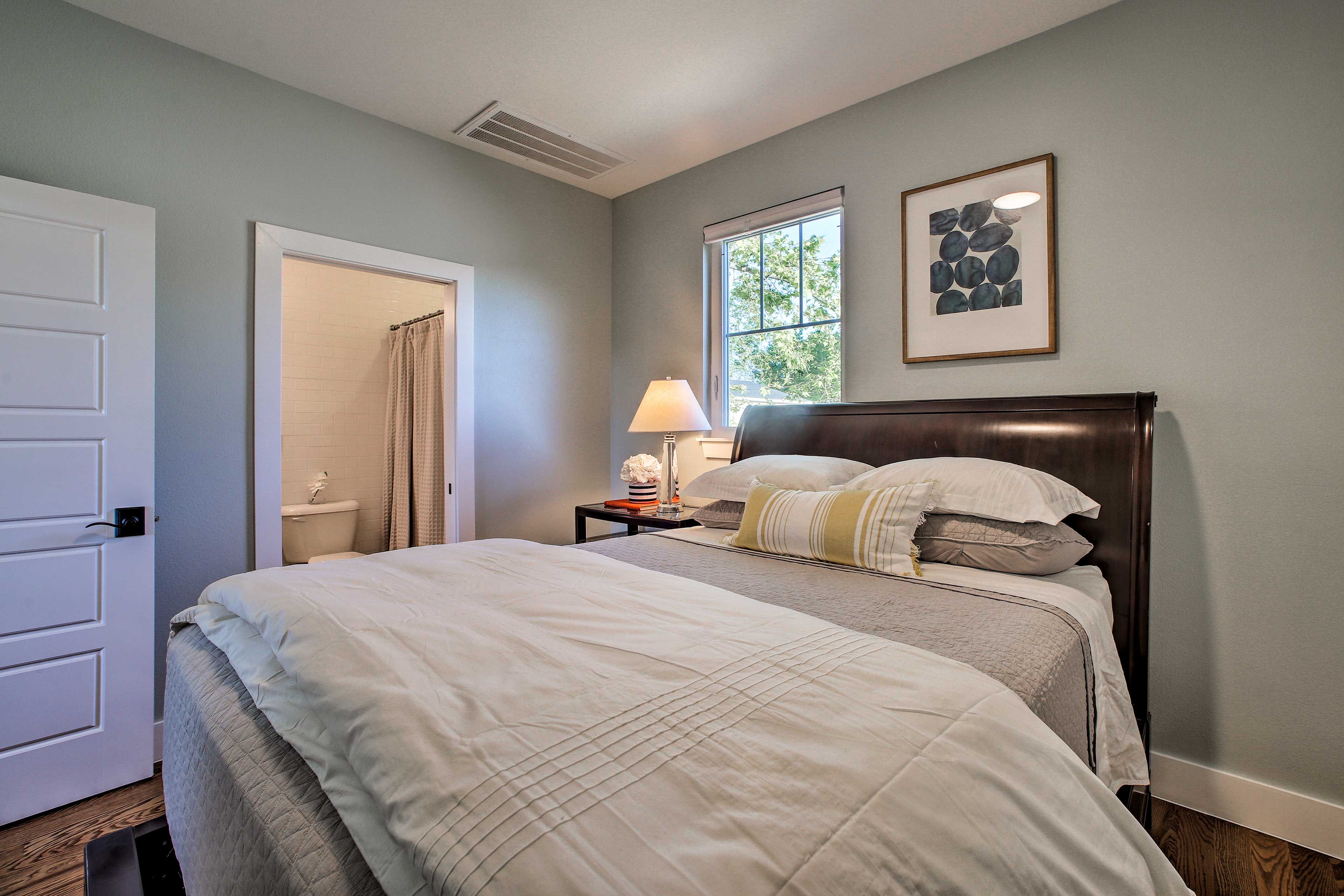 The bathroom is tucked in the corner.