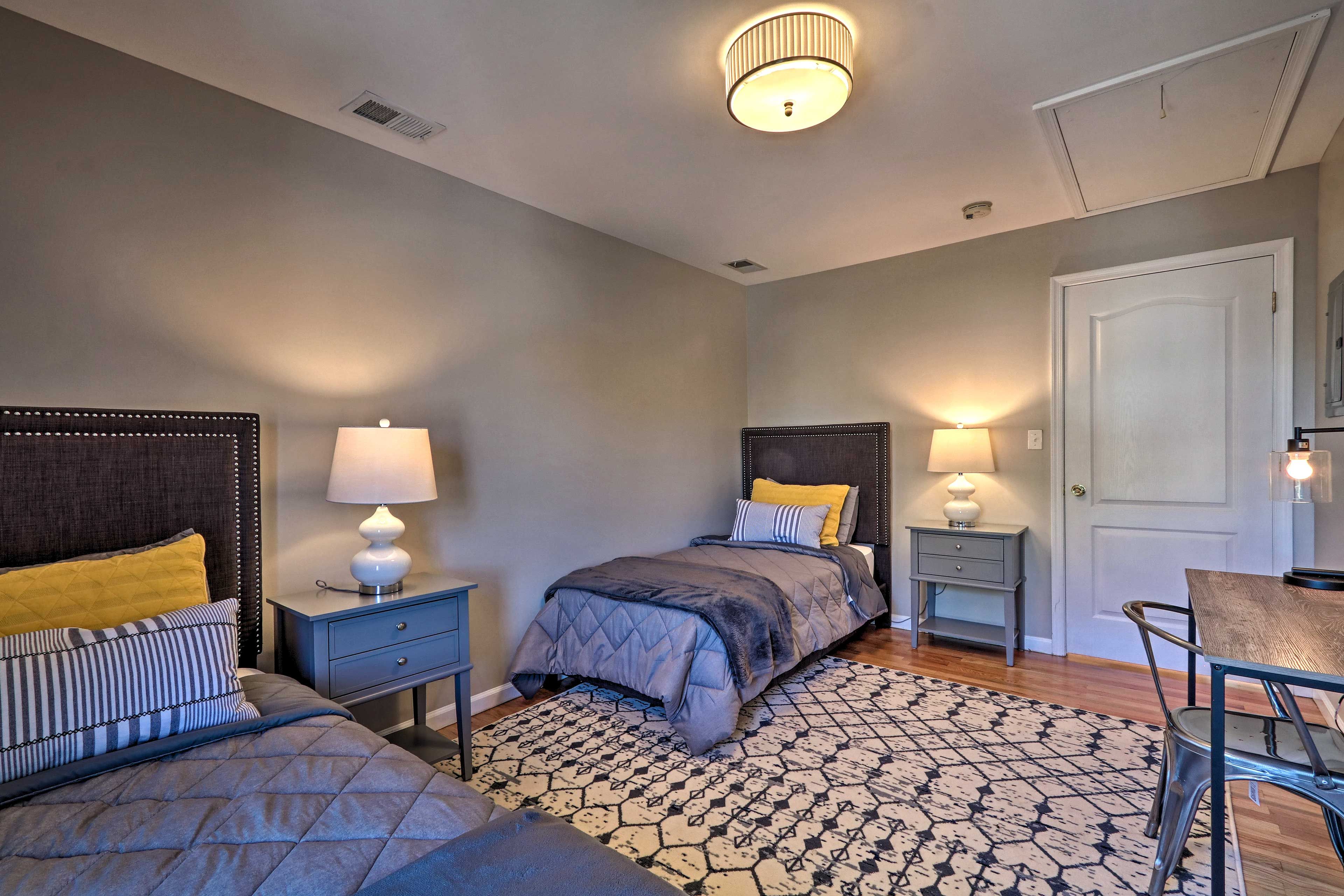 The second bedroom is ideal for the kids, boasting 2 twin beds!