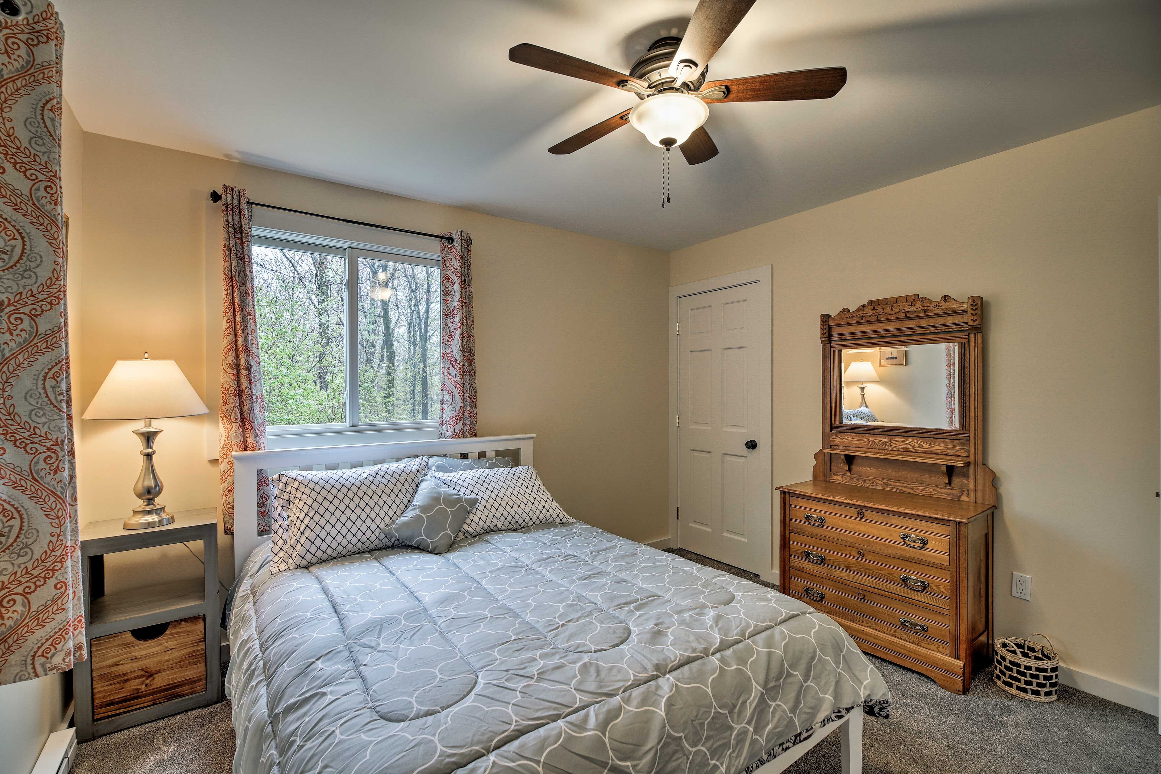 A bedside lamp provides a soft glow to the room.