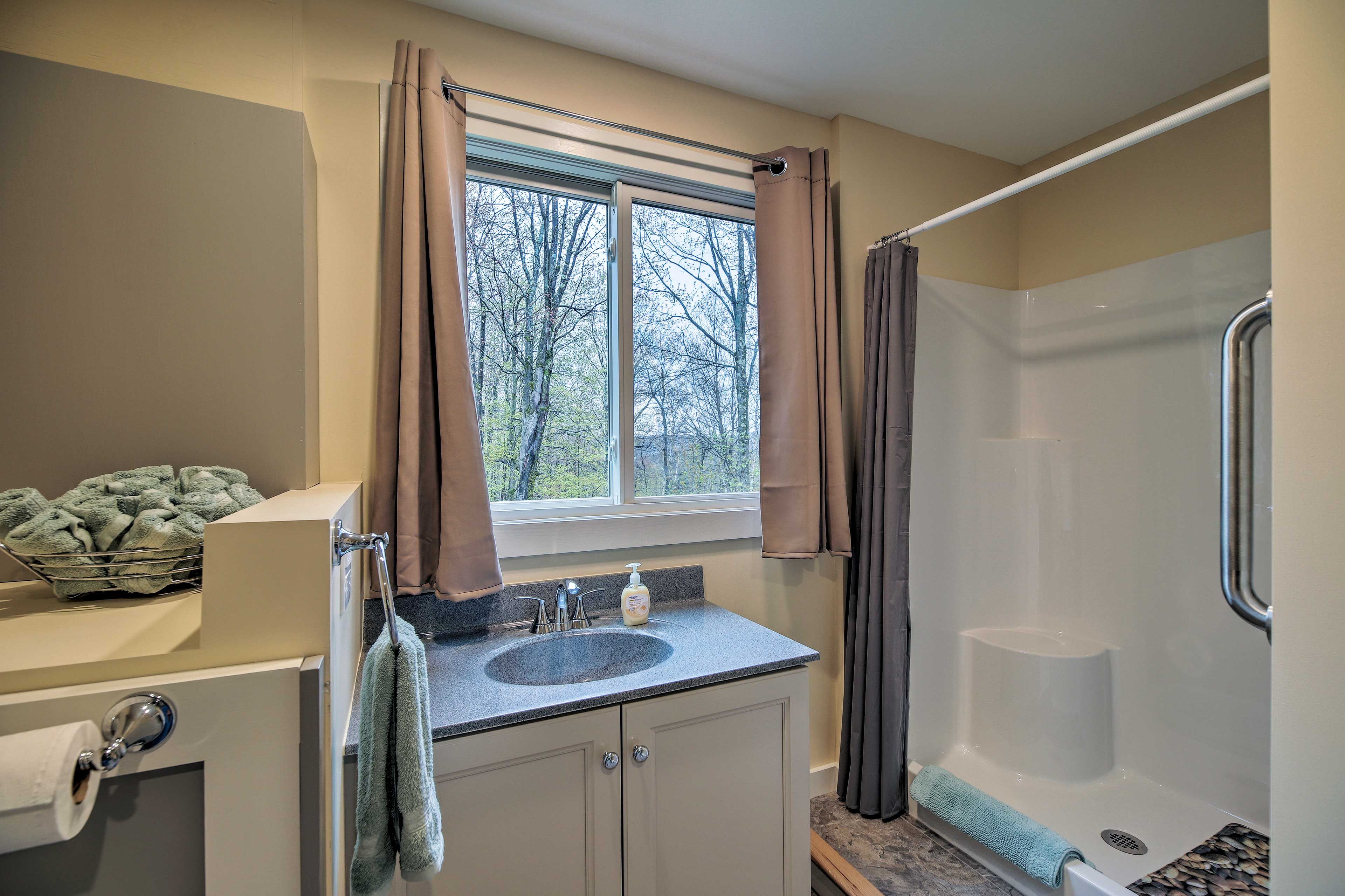 The shower is easily accessible without a ledge to step over.