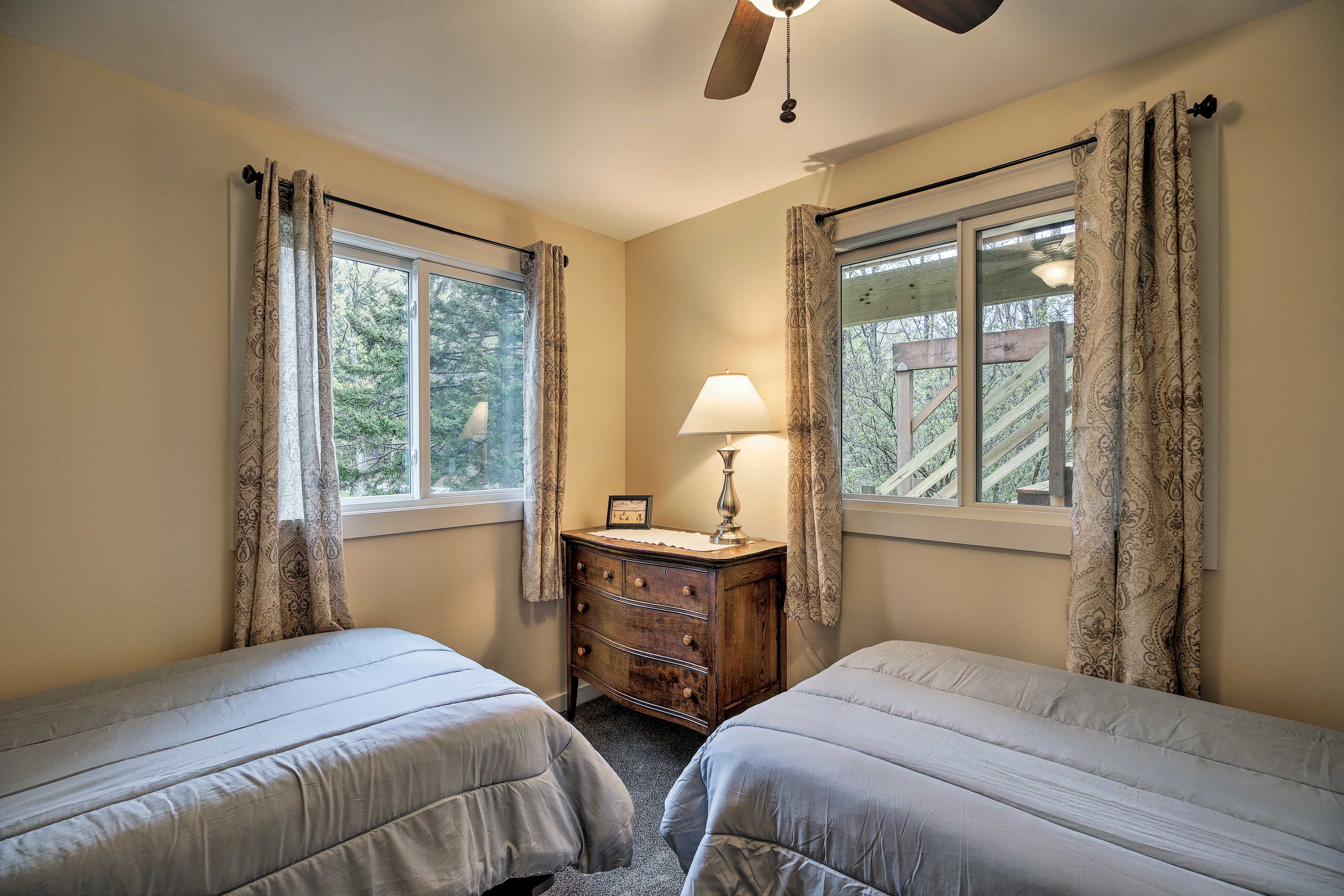 Up to 2 guests can share this bedroom with 2 twin beds.