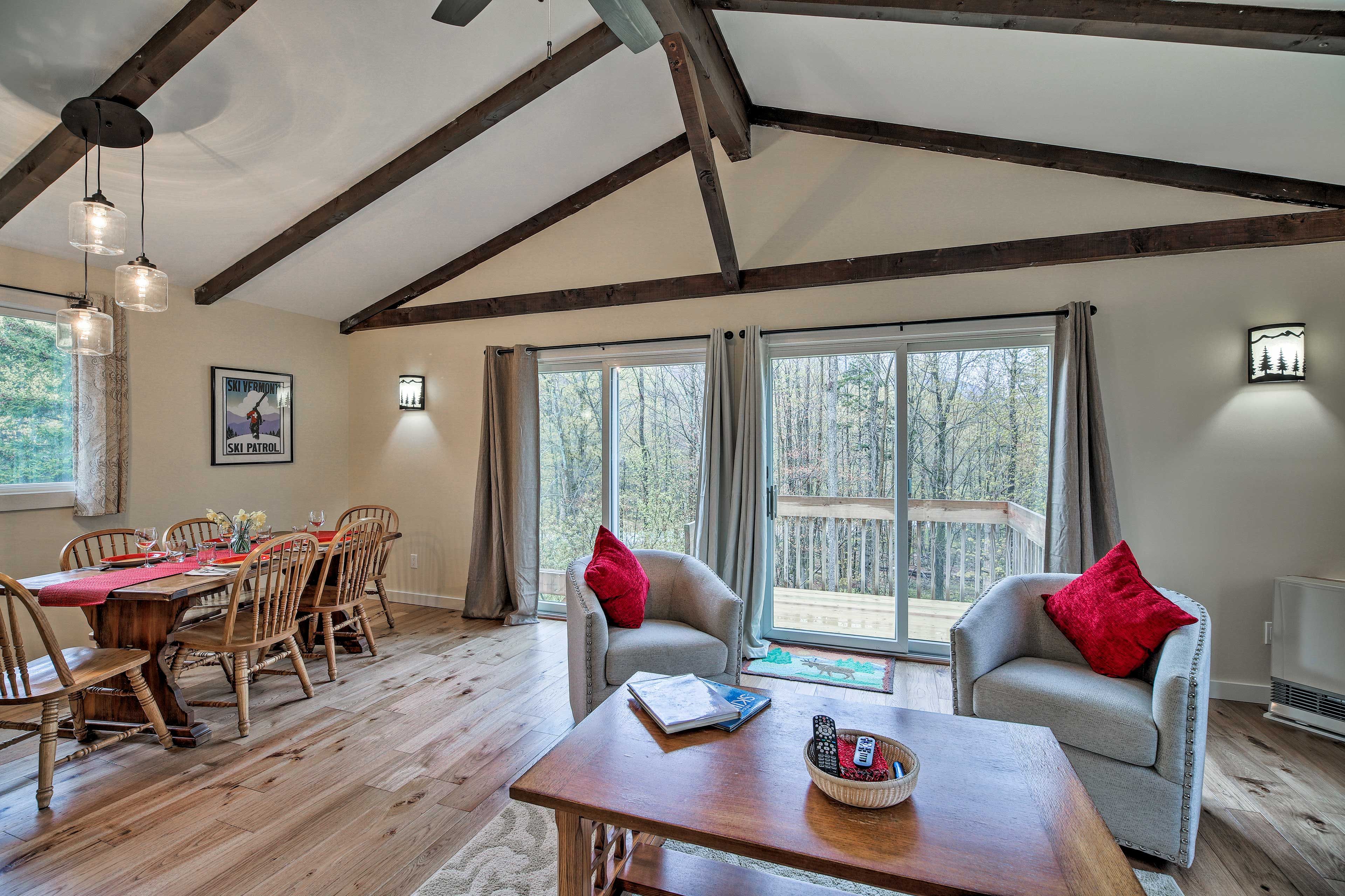 Natural light streams in through expansive glass doors and windows.