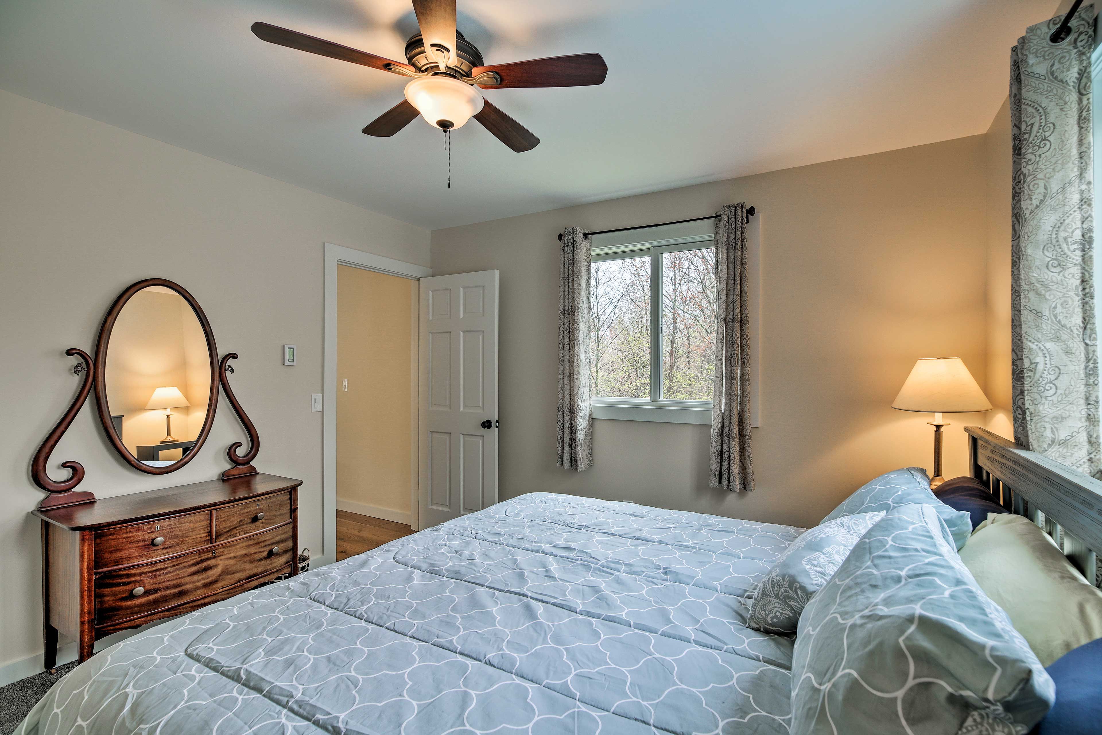 This bedroom features a comfortable king-sized bed.