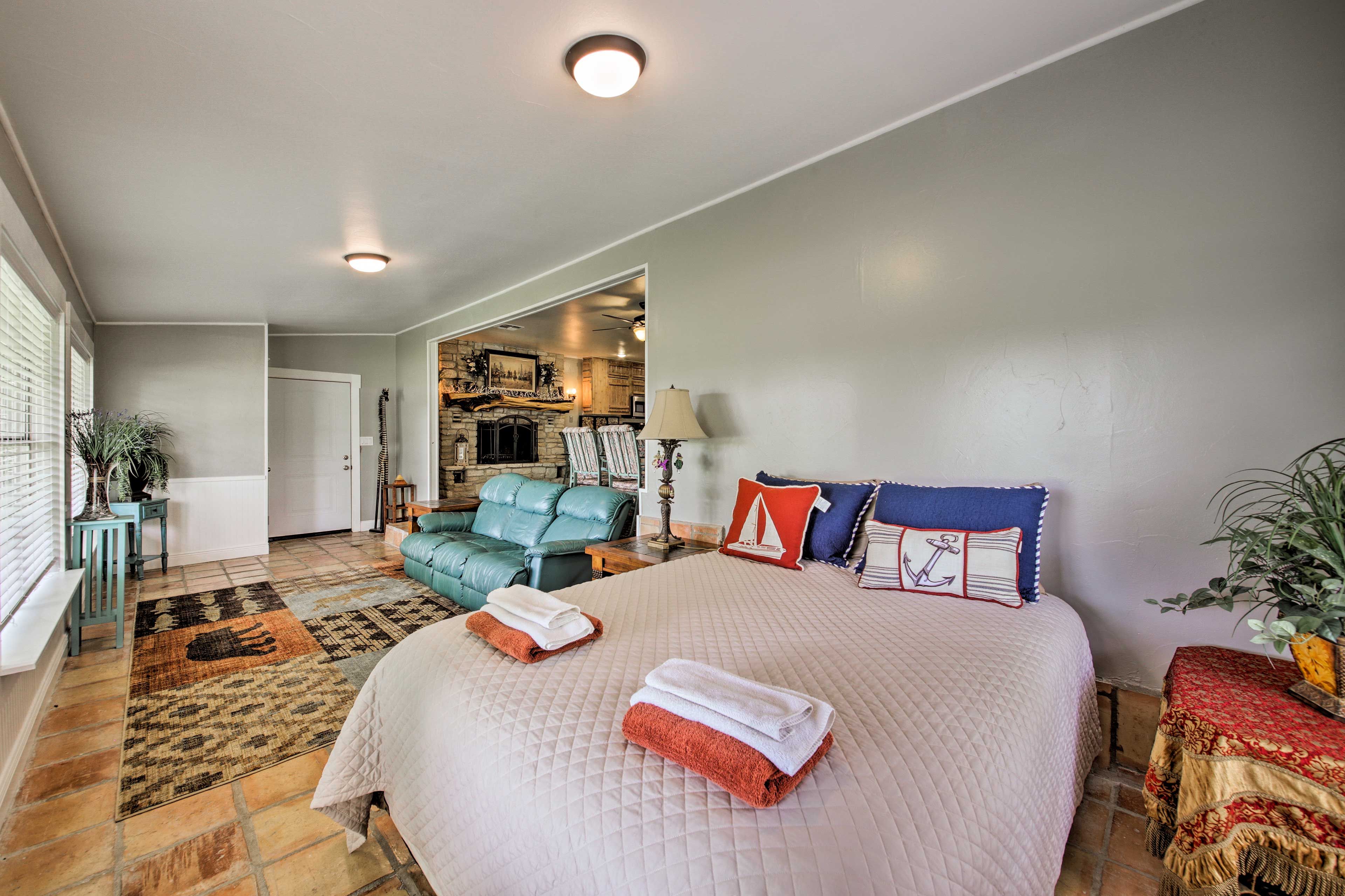 The queen bed in the sunroom sleeps 2.