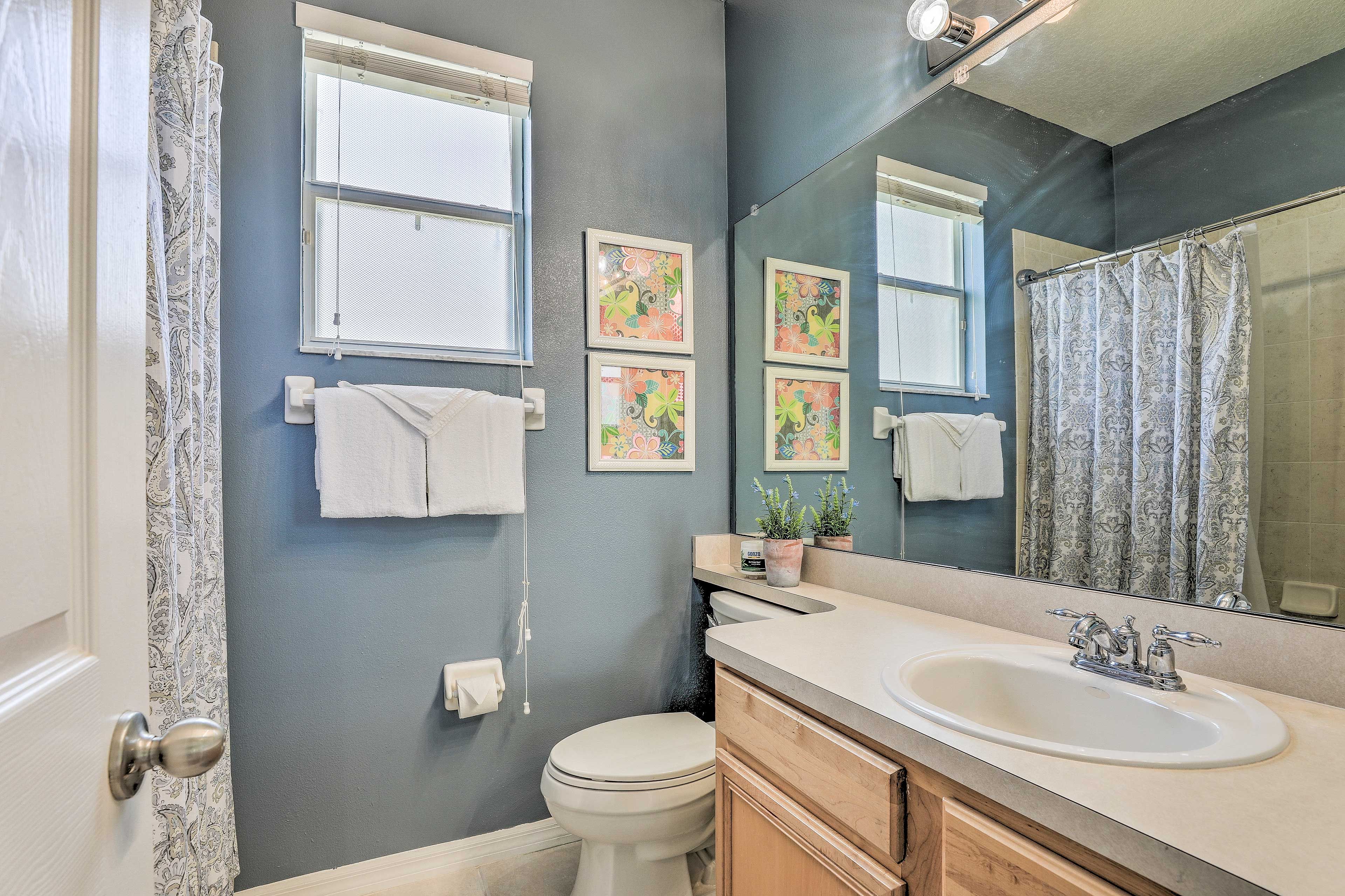Wash away the day in the shower/tub combo.