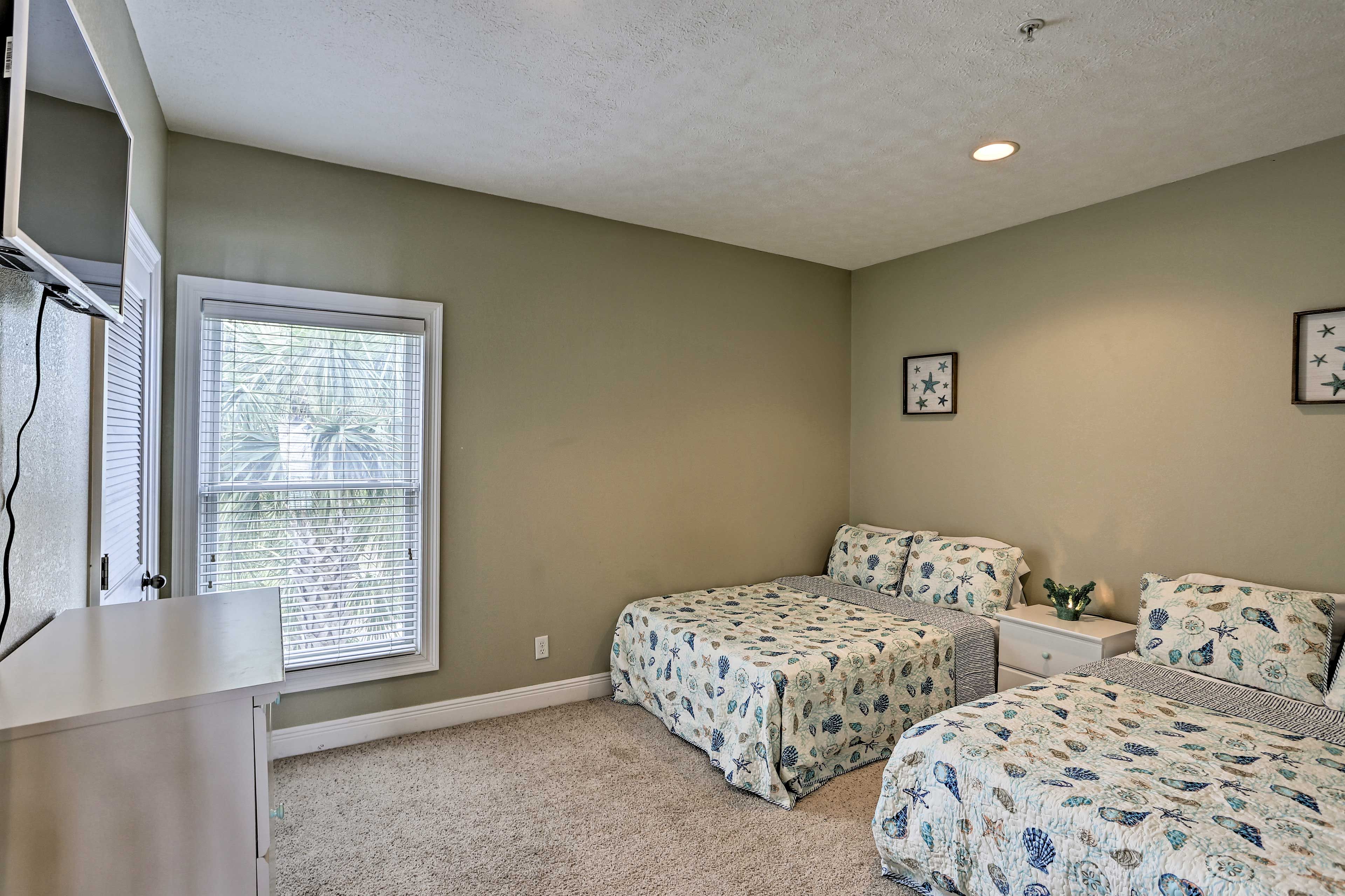 The second bedroom has 2 full beds.
