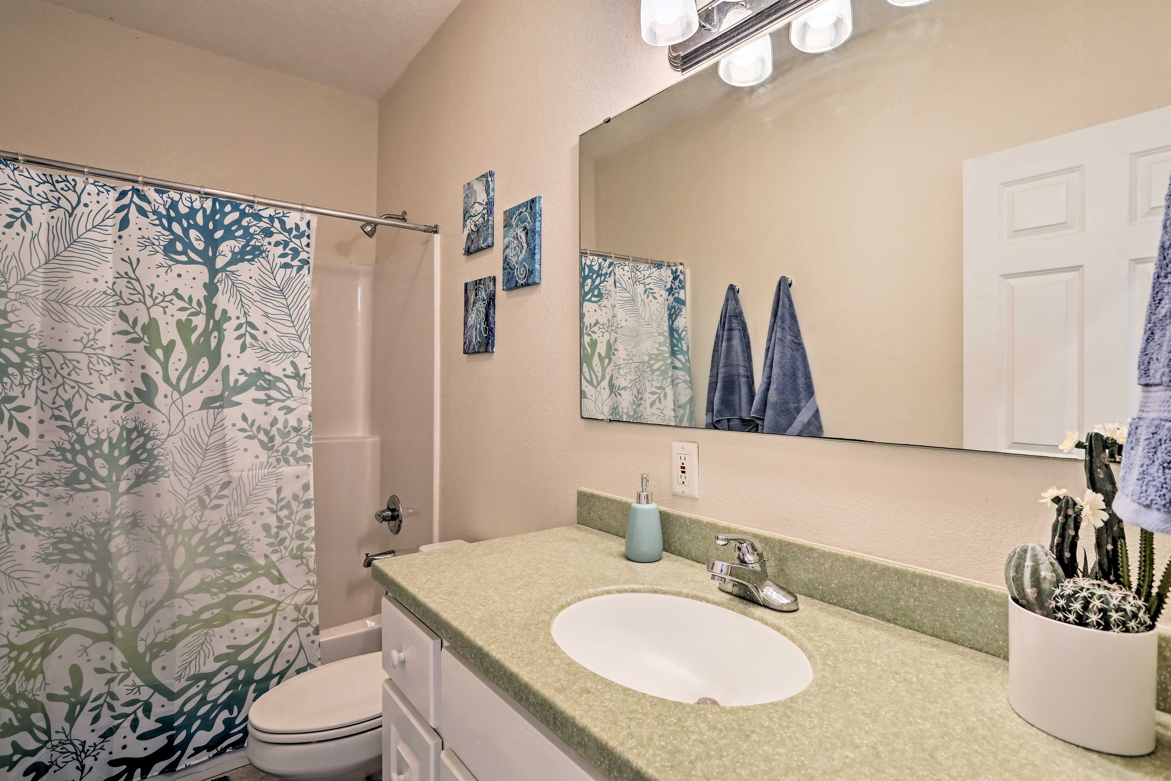 Rinse away the day in the shower/tub combo.