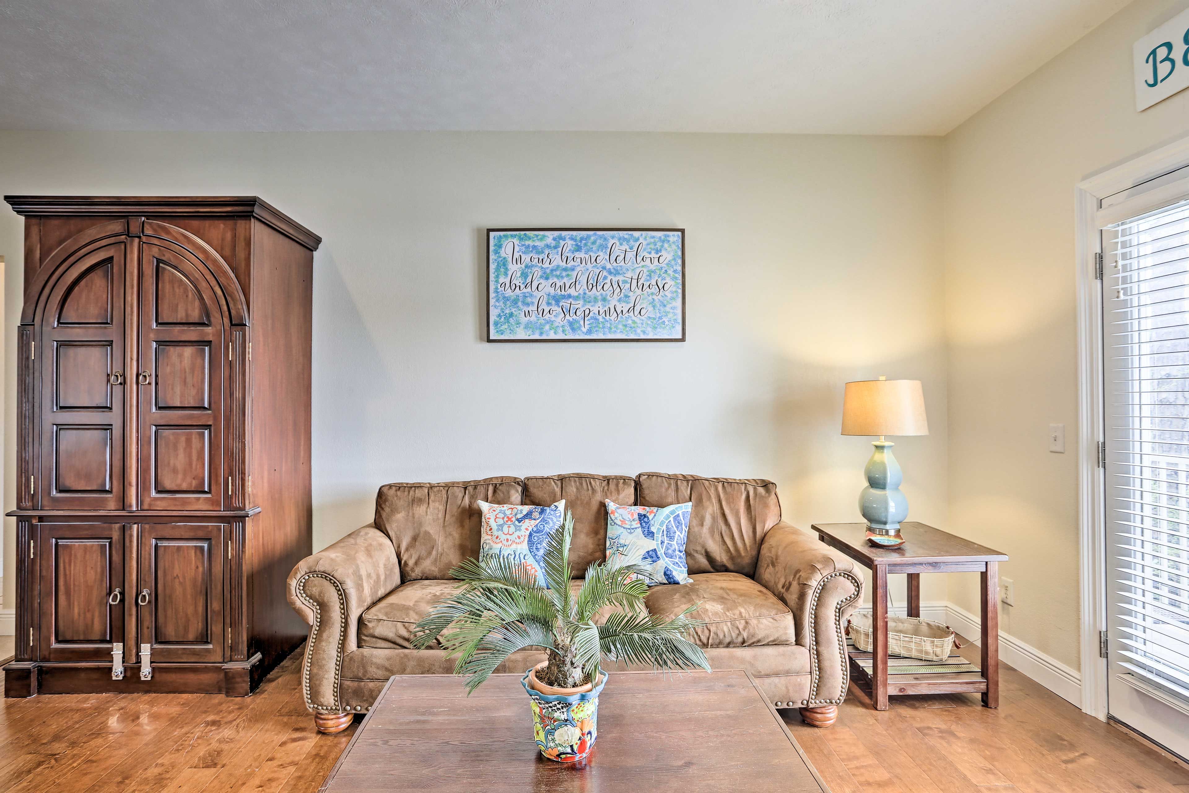 The couch can comfortably accommodate 2 additional guests.