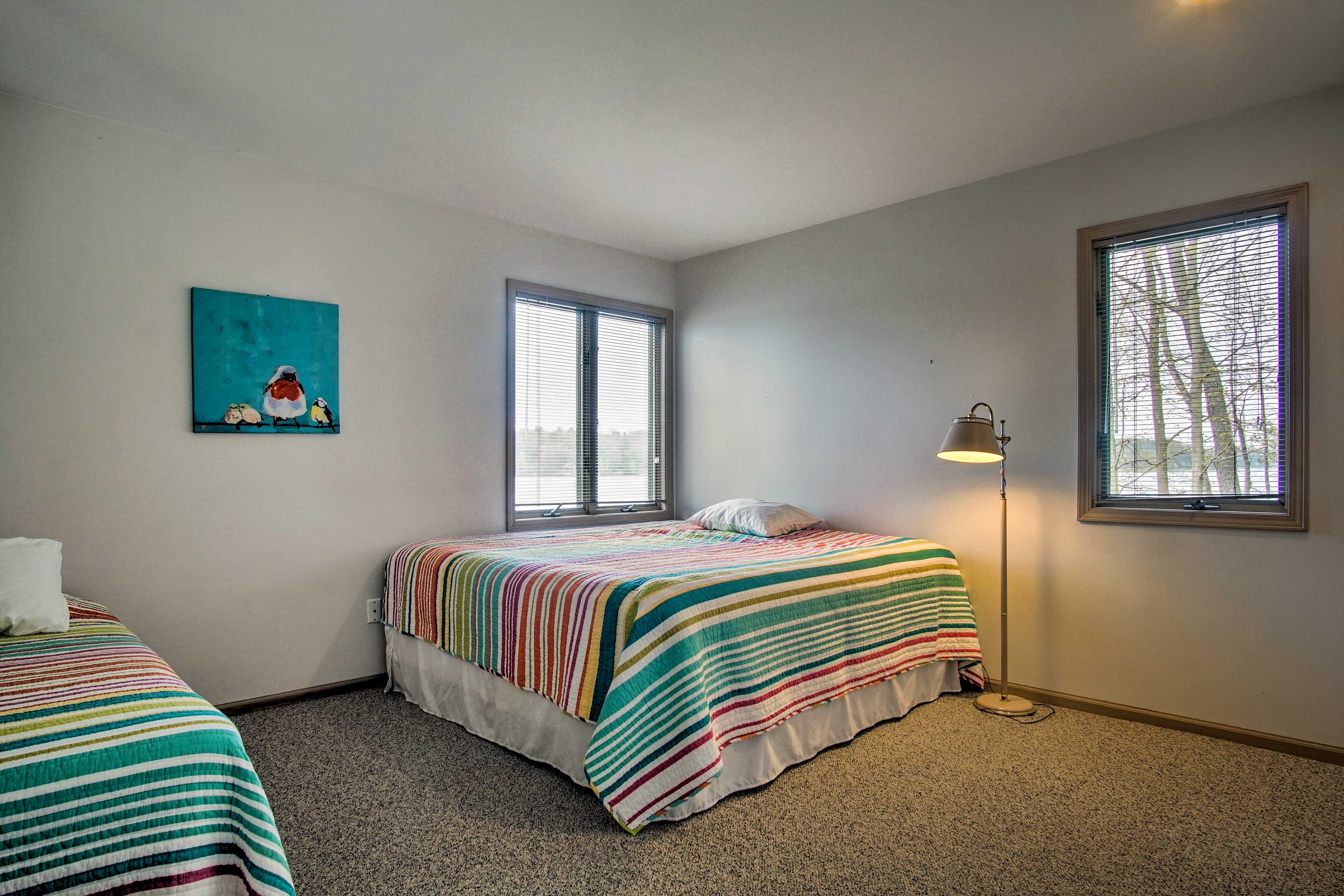 This bedroom offers a king bed and twin bed.