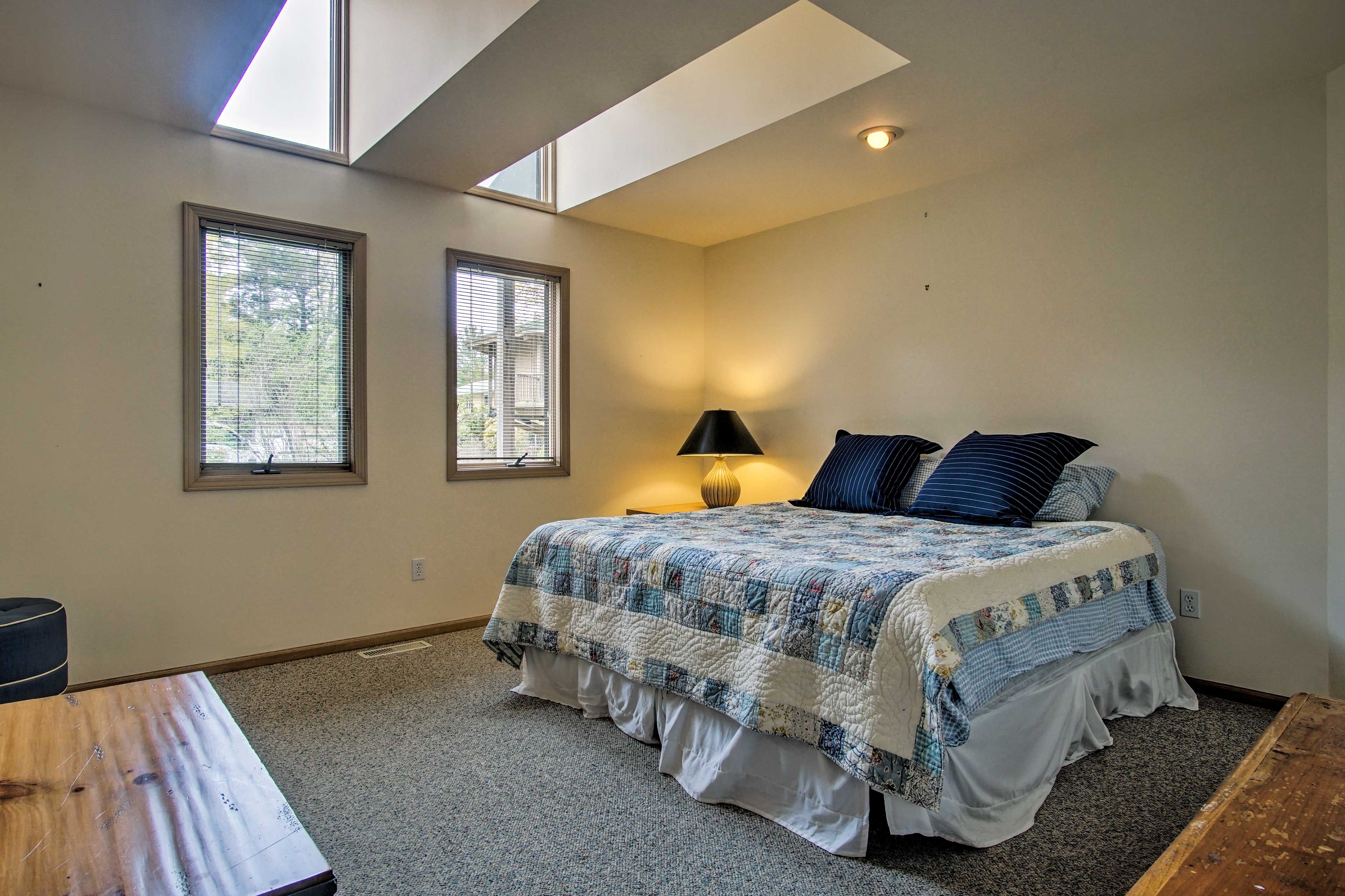 Cuddle up with a loved one in this king-sized bed for a good rest.