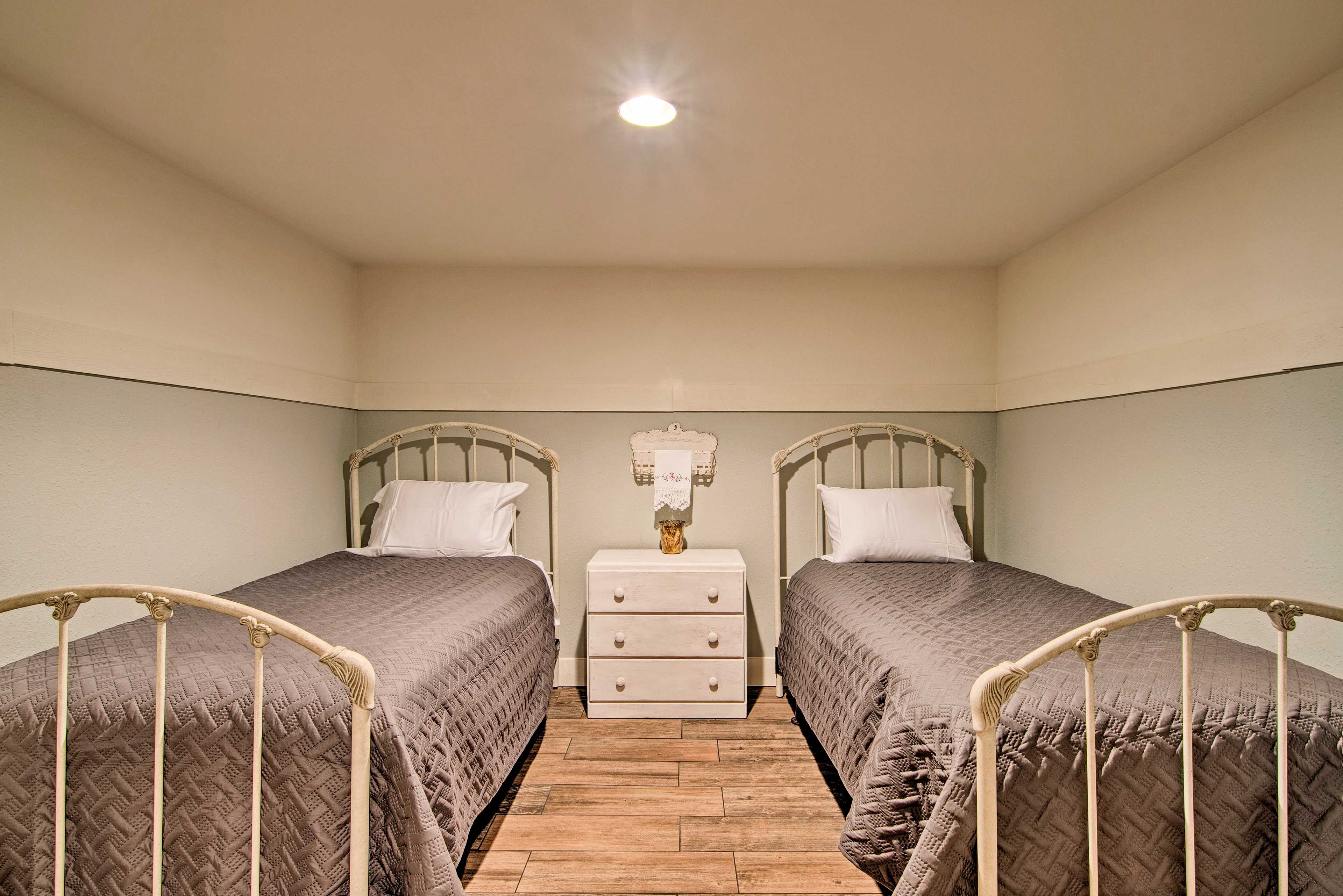 Two twin beds are in this cozy room.
