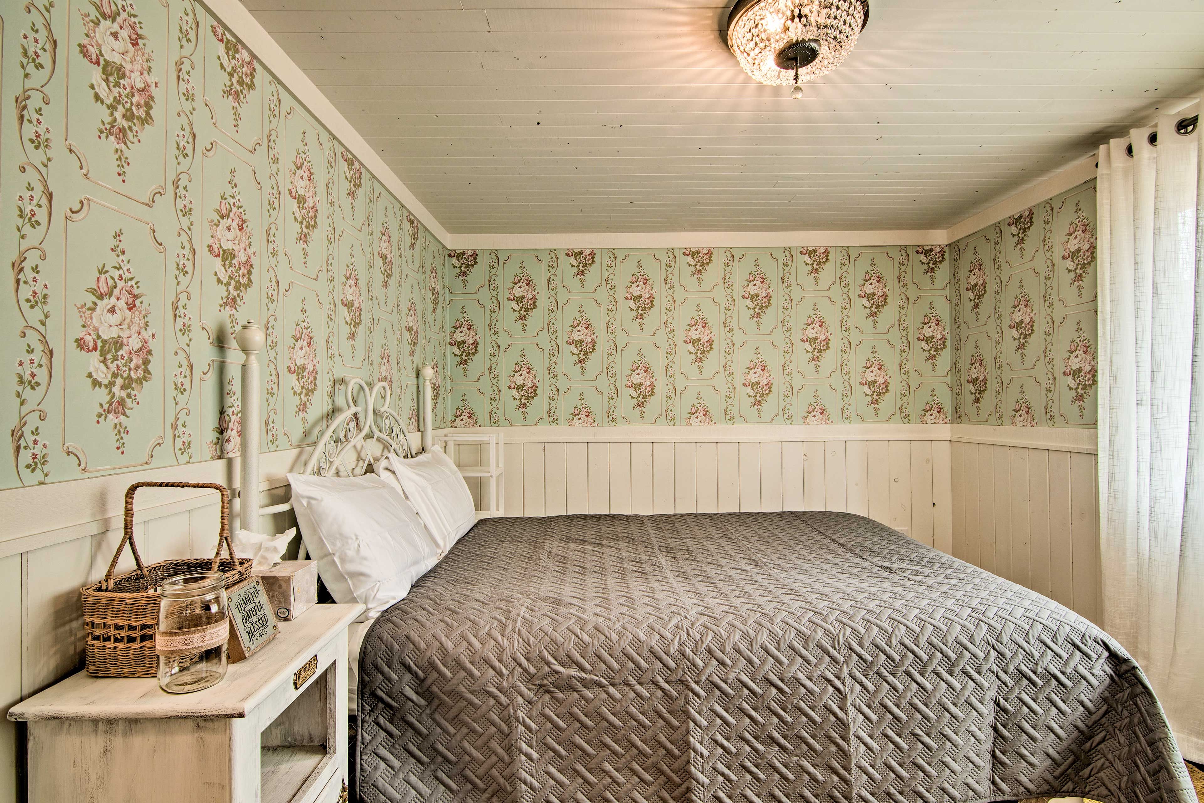 This bedroom includes a full-sized bed.