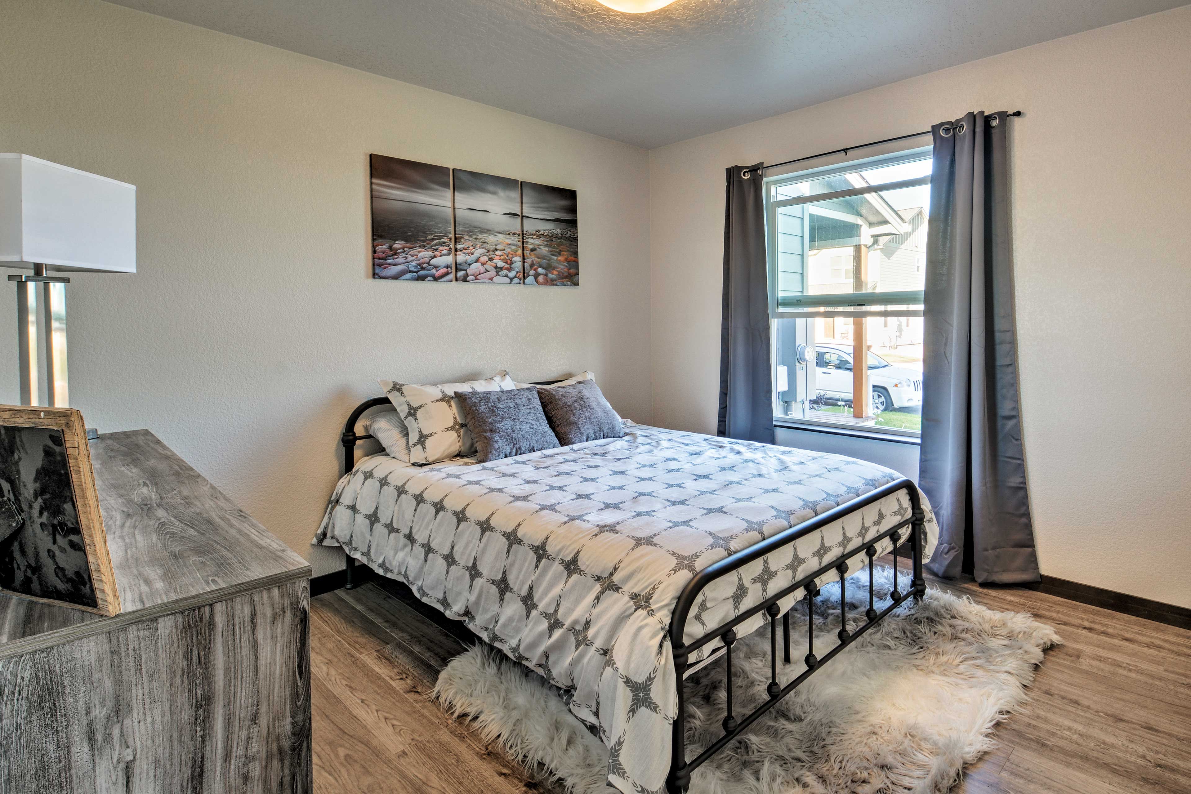 Step into bedroom 2 with a queen-sized bed.