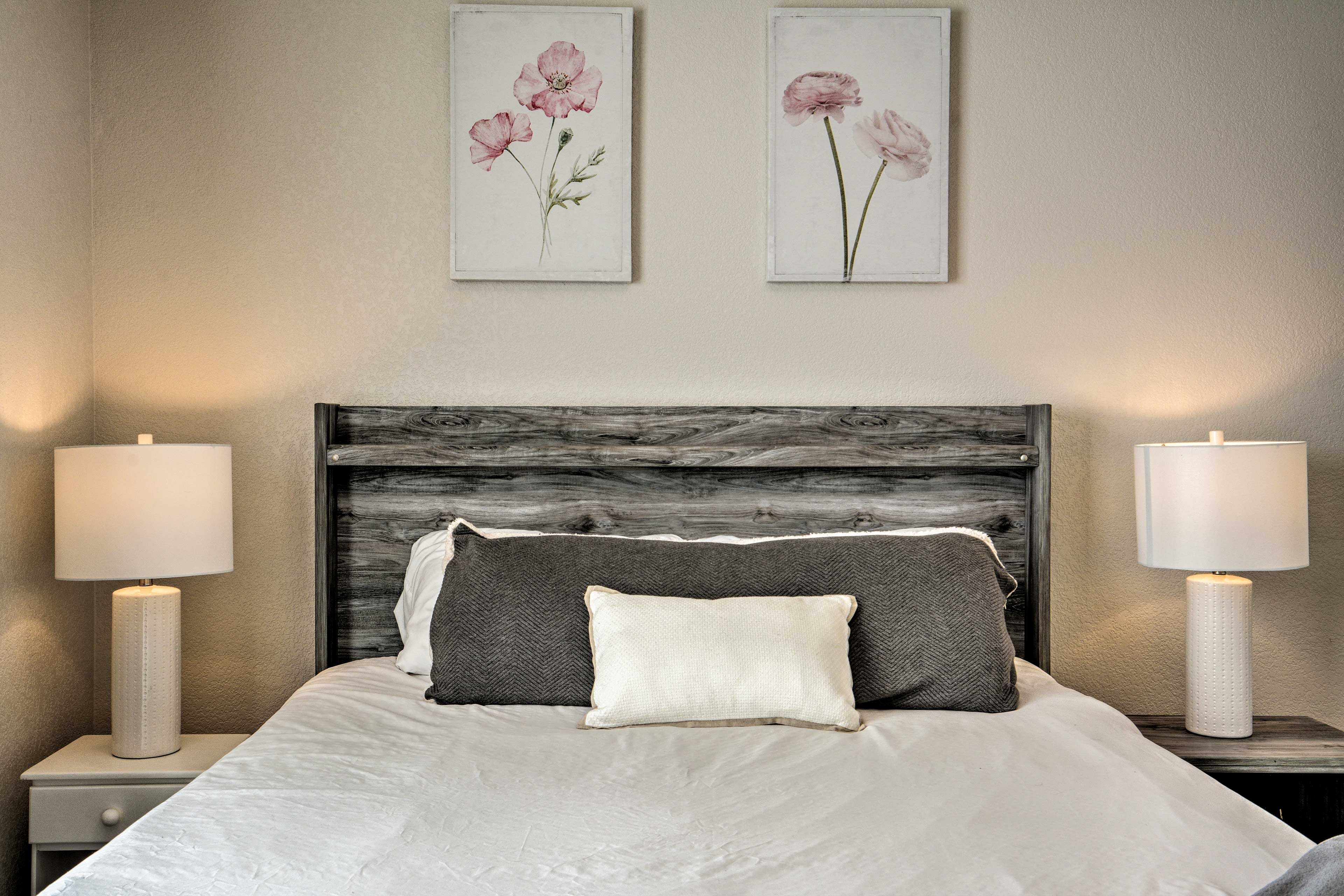 Rest your head in this queen-sized bed of bedroom 1.