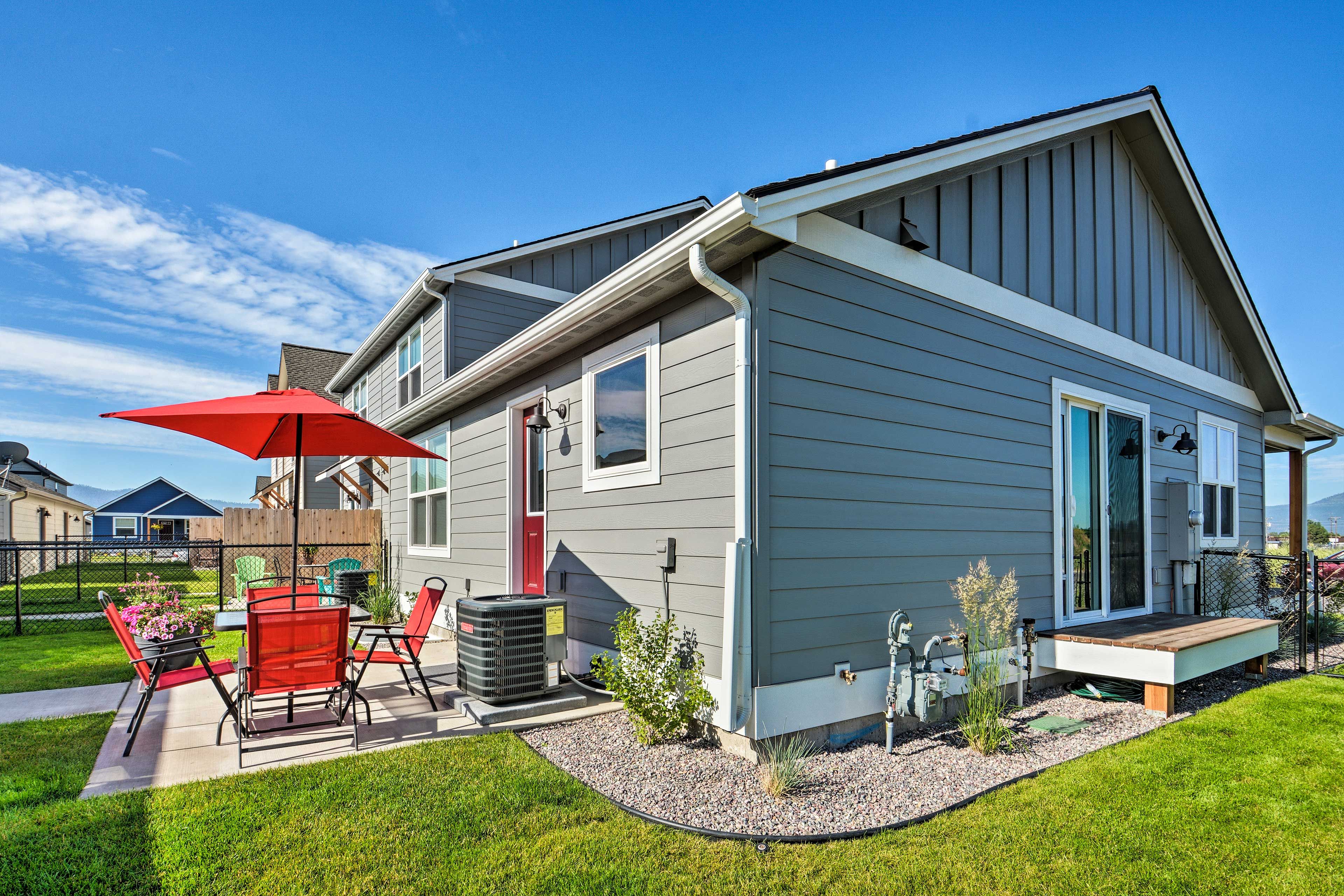 Step around the side of the house to enjoy the yard.