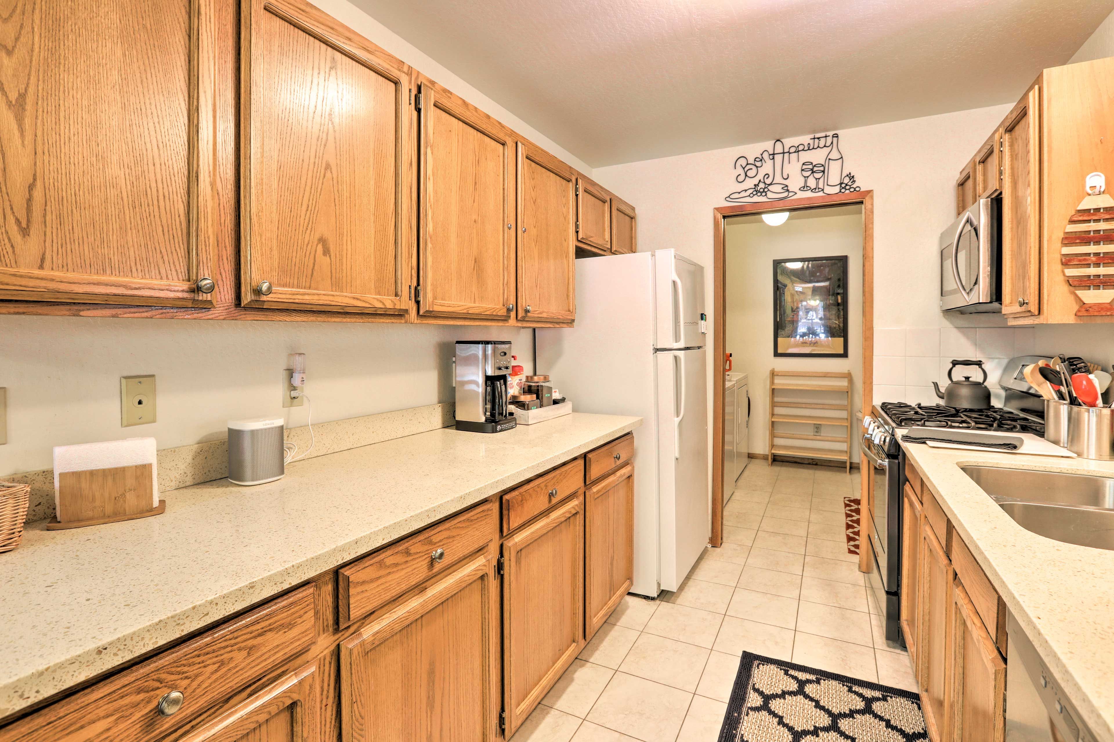 The full kitchen provides ample counter space for easy meal prep.