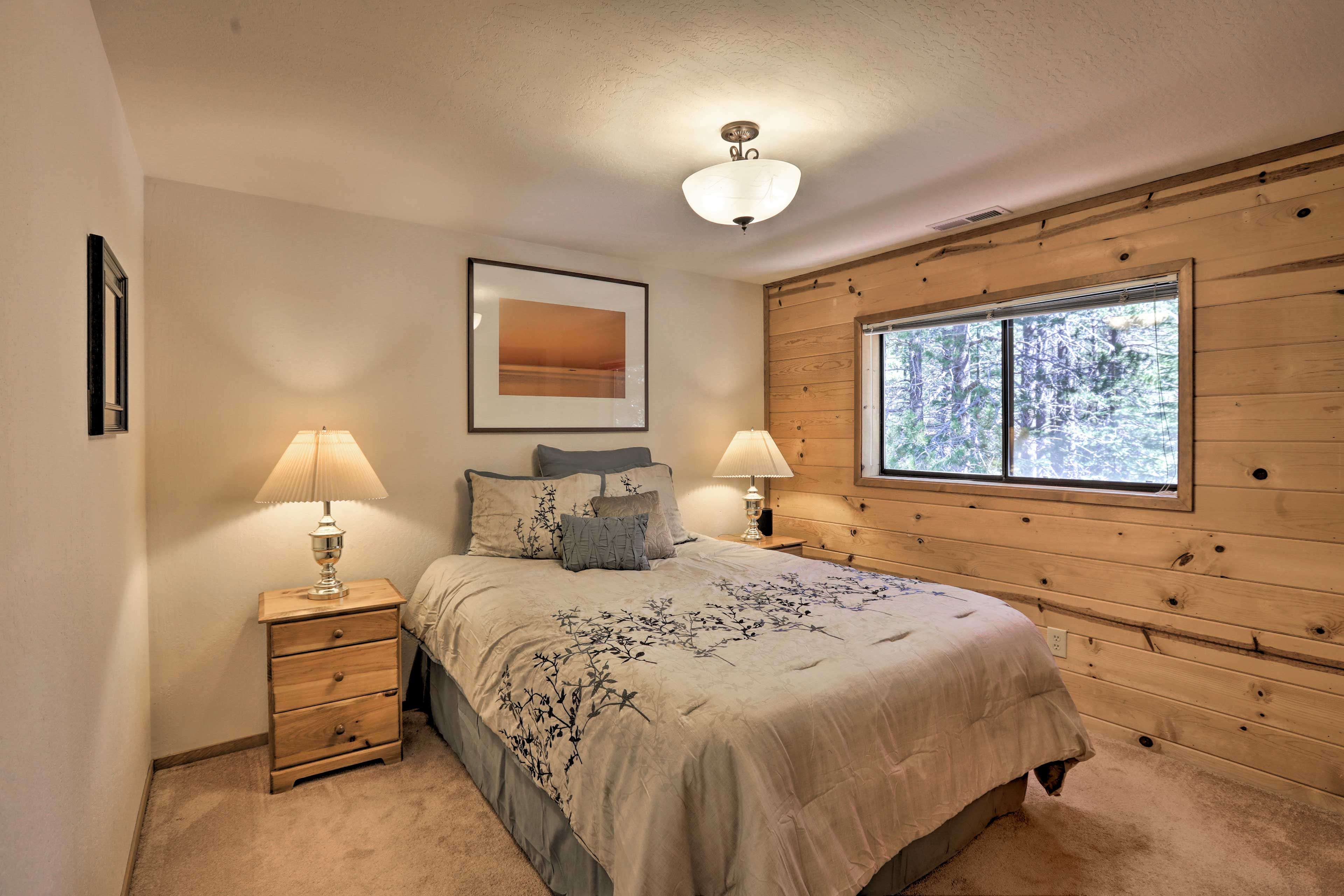 This bedroom includes a full-sized bed.