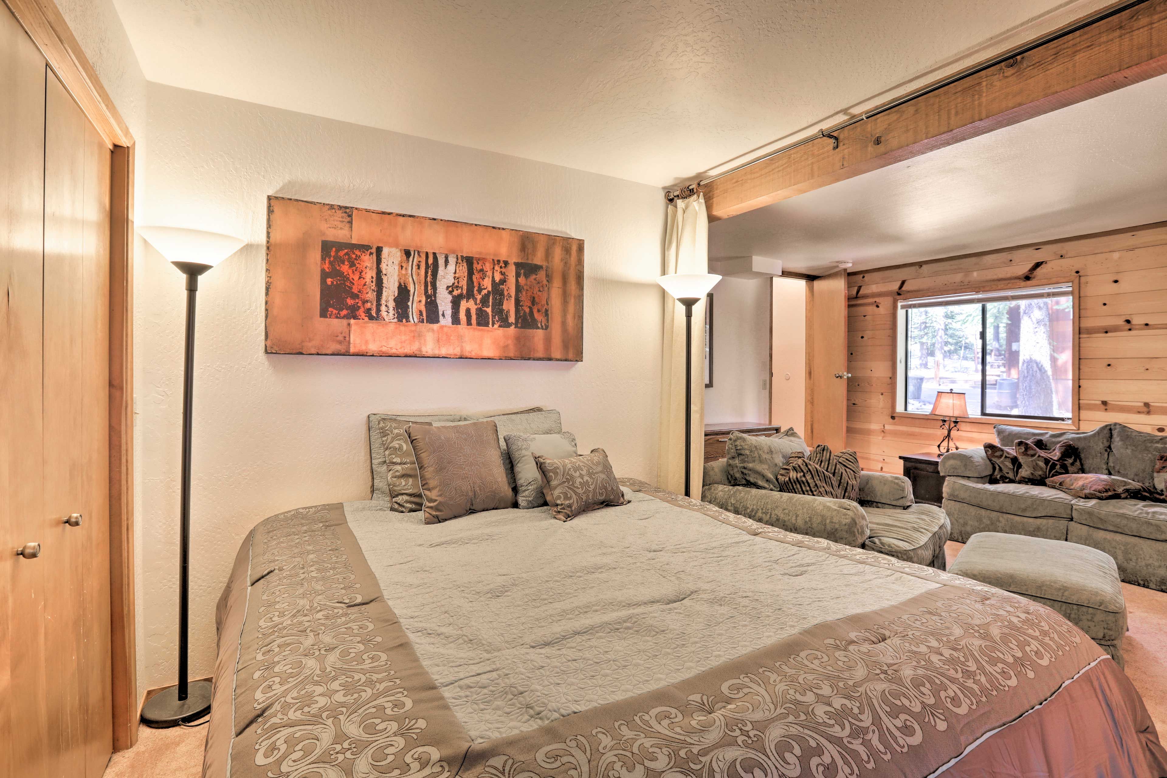 Downstairs doubles as a bedroom with a queen bed.