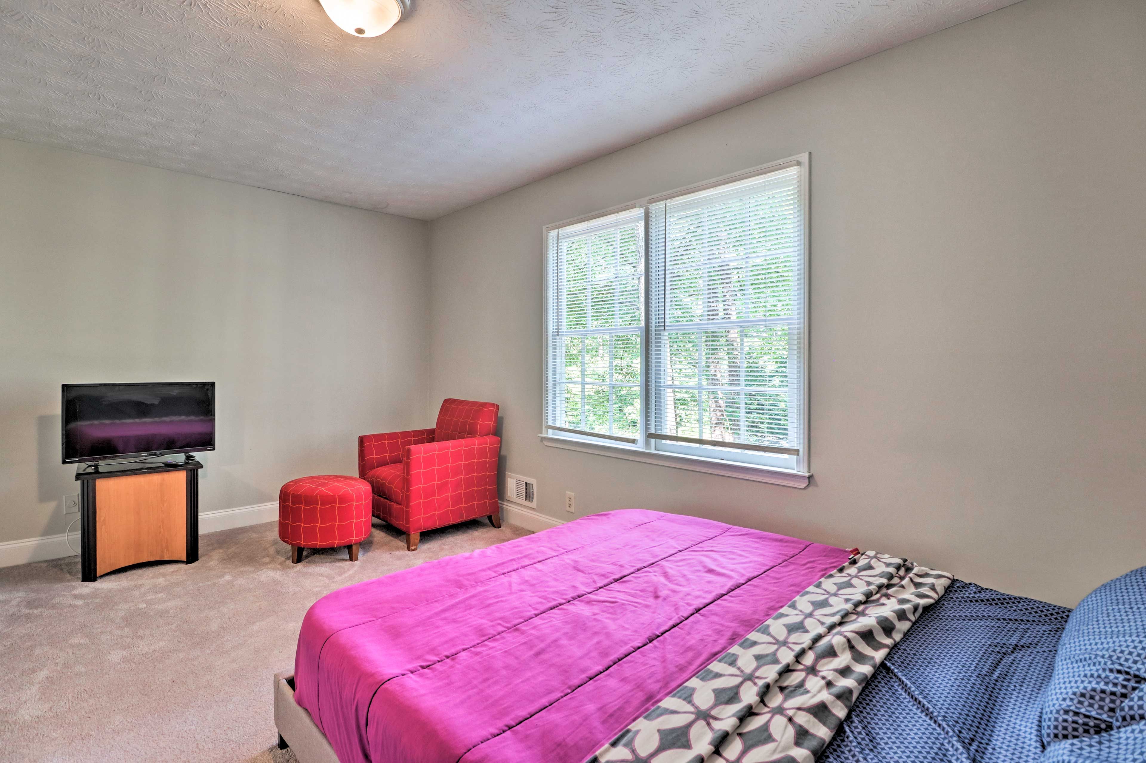 Curl up in bed for a cozy movie night, thanks to the flat-screen cable TV.