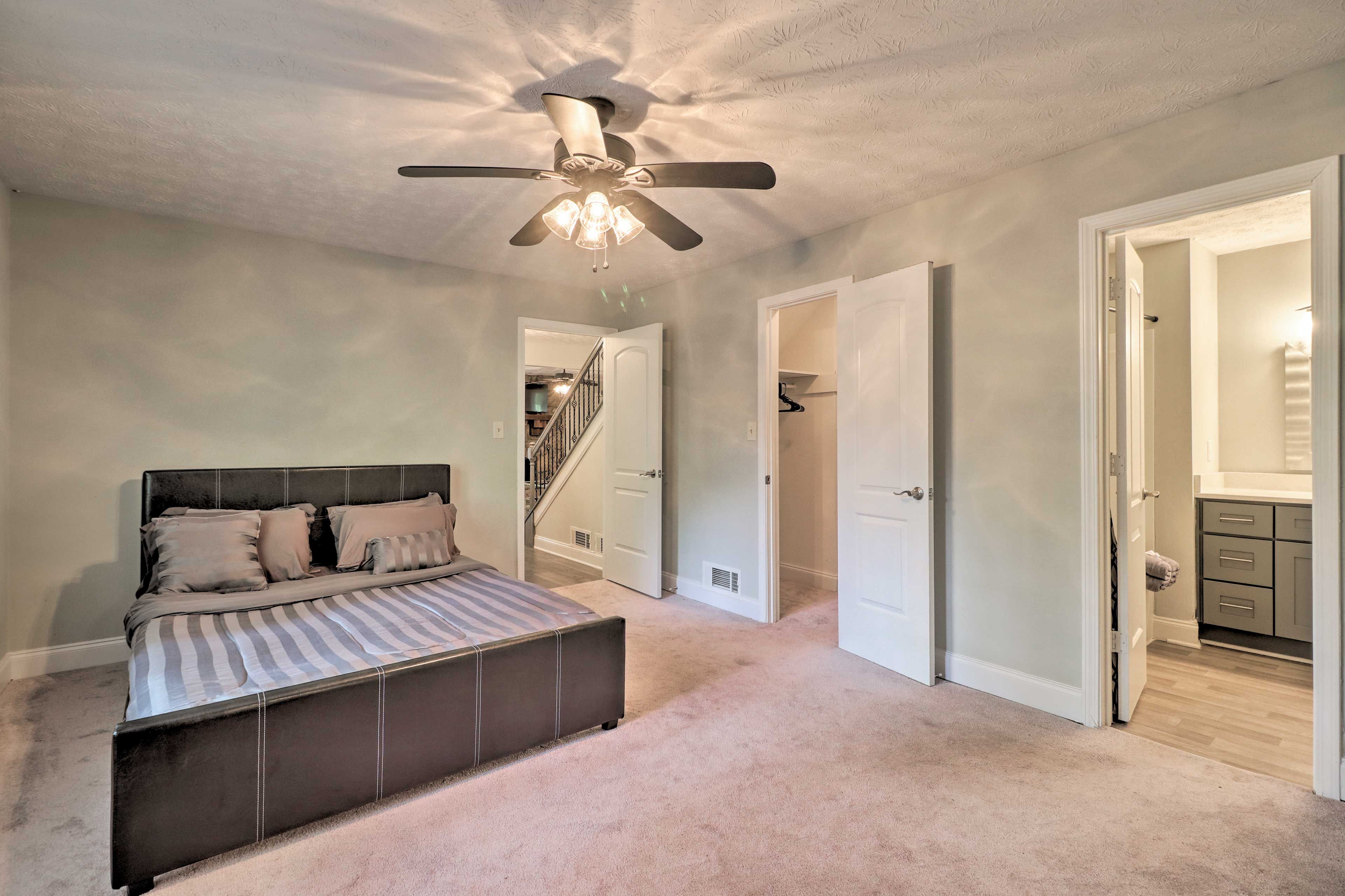 The first bedroom boasts a queen bed & a walk-in closet.
