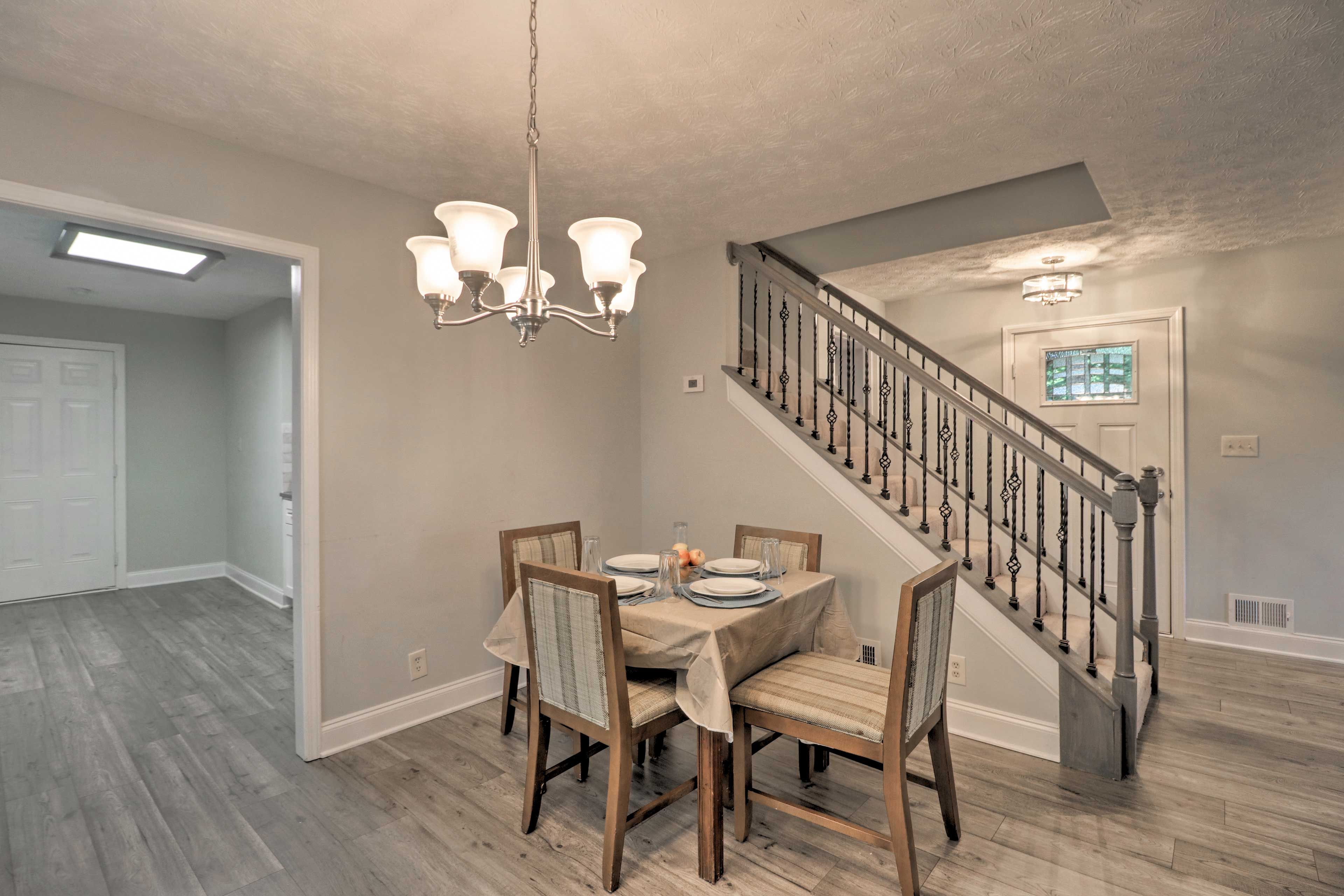 The 4-person dining table offers a cozy space to dine.