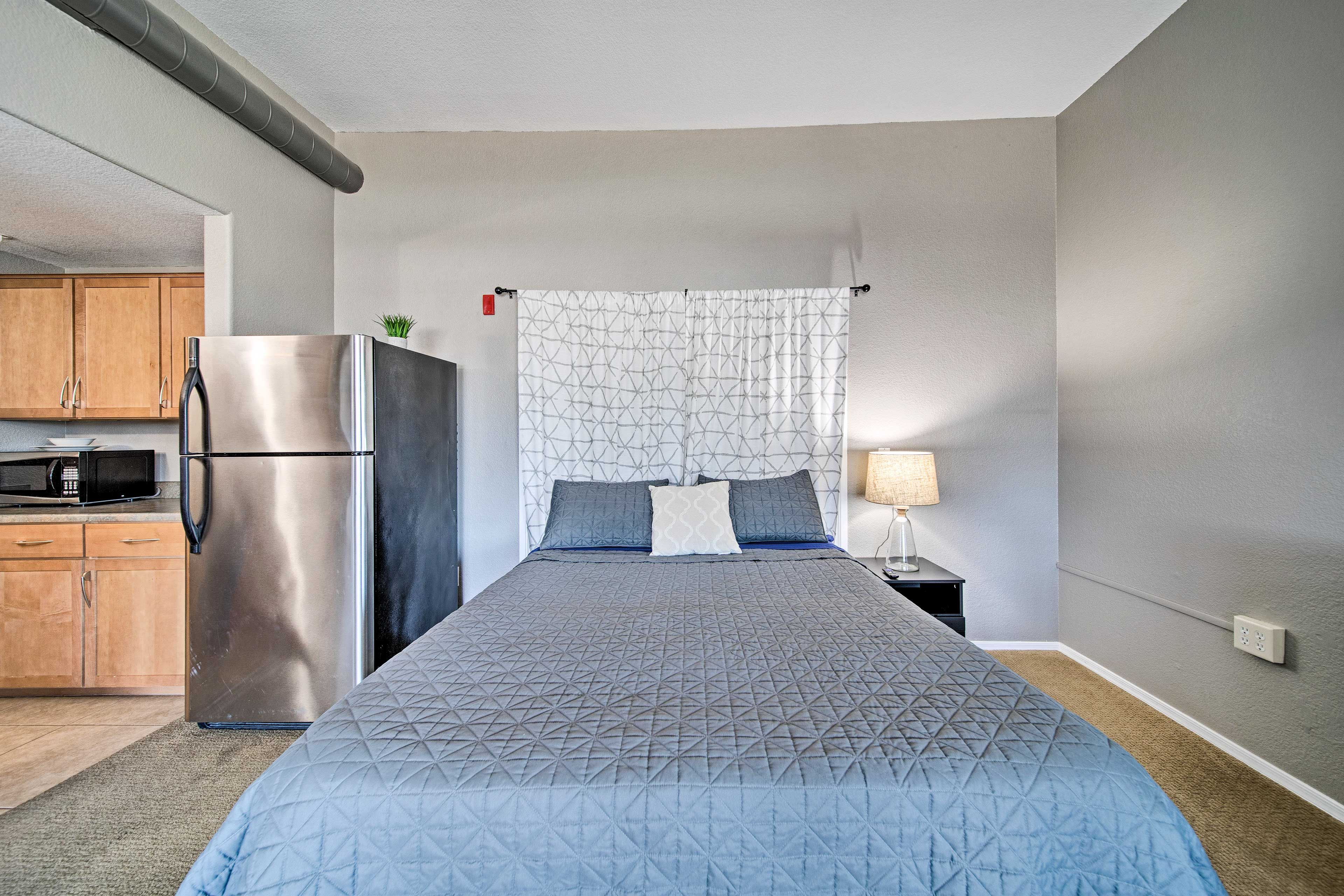 Slip under the covers of the queen-sized bed.