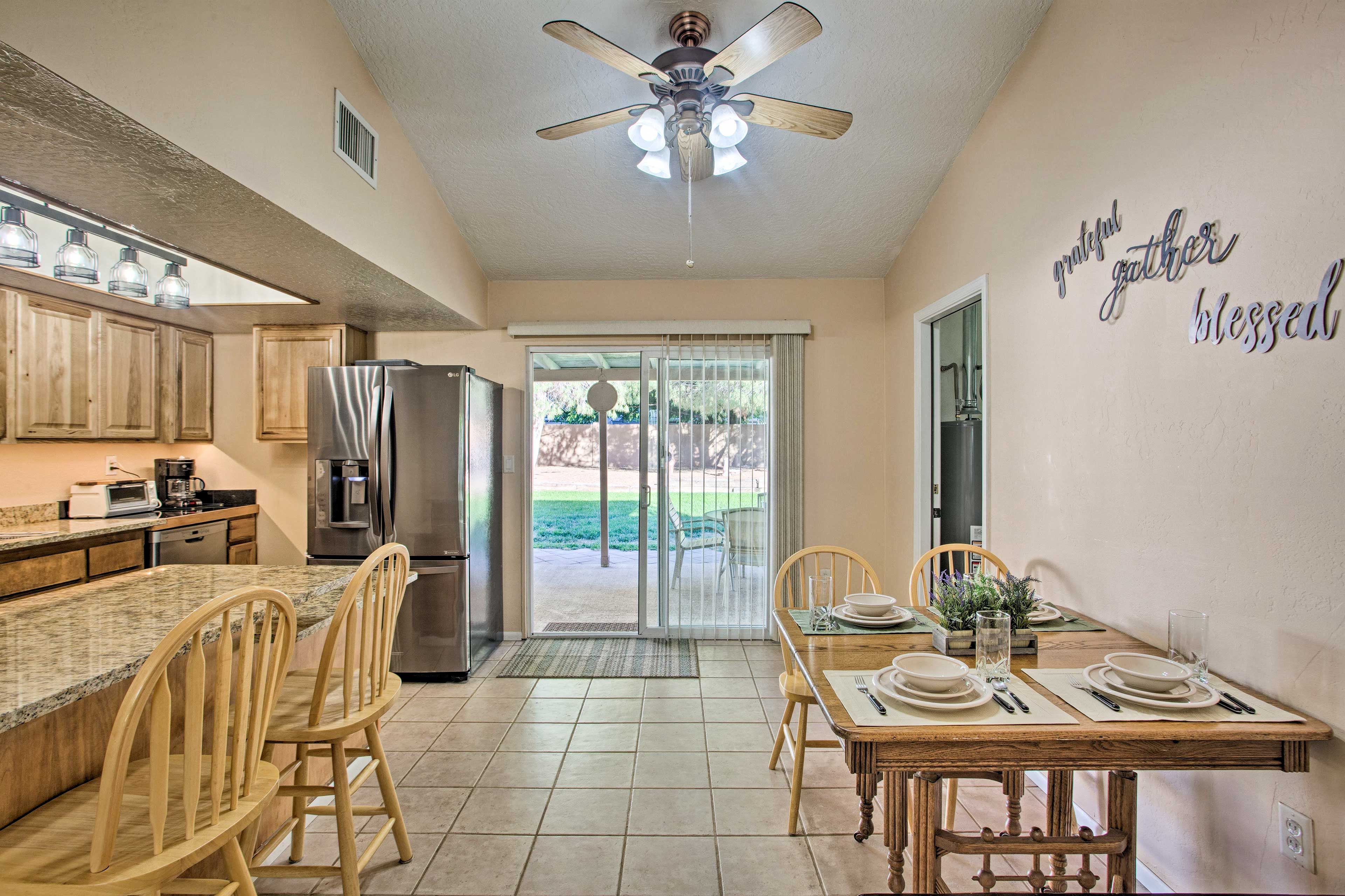 The full kitchen has granite countertops and stainless steel appliances.