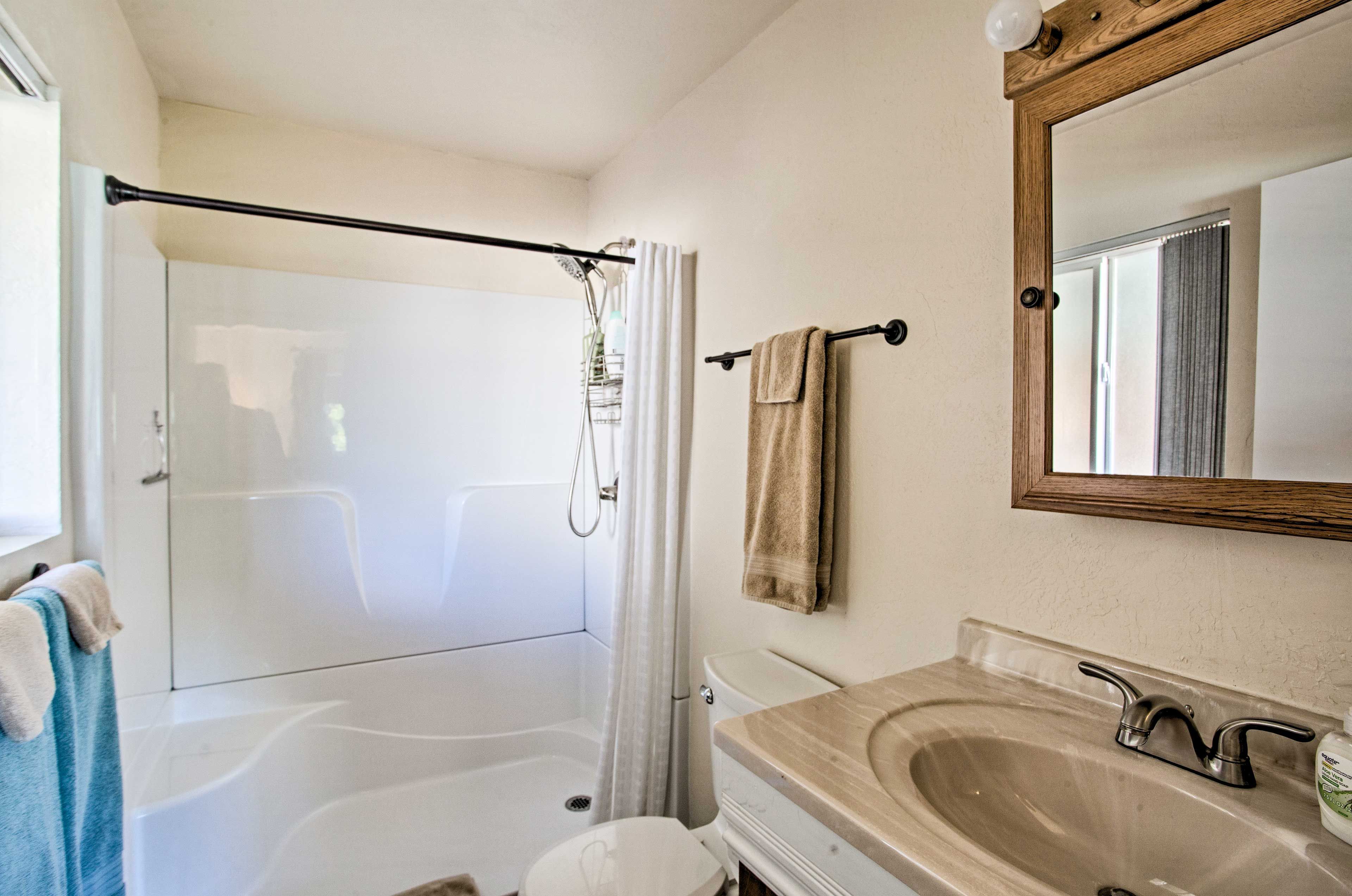 Rinse away the day in this large white stand-up shower.