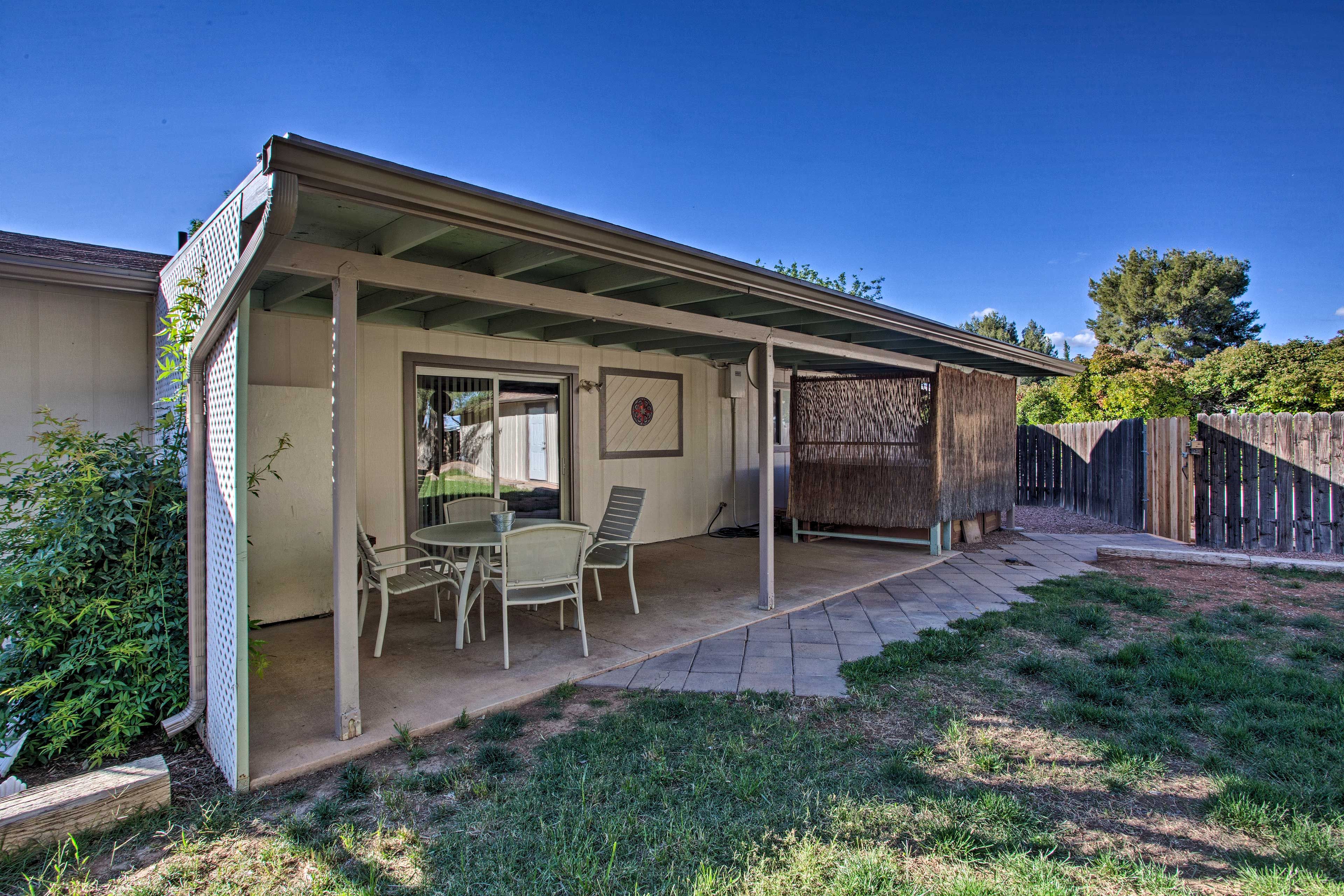 This beautiful home has plenty of space in the backyard.