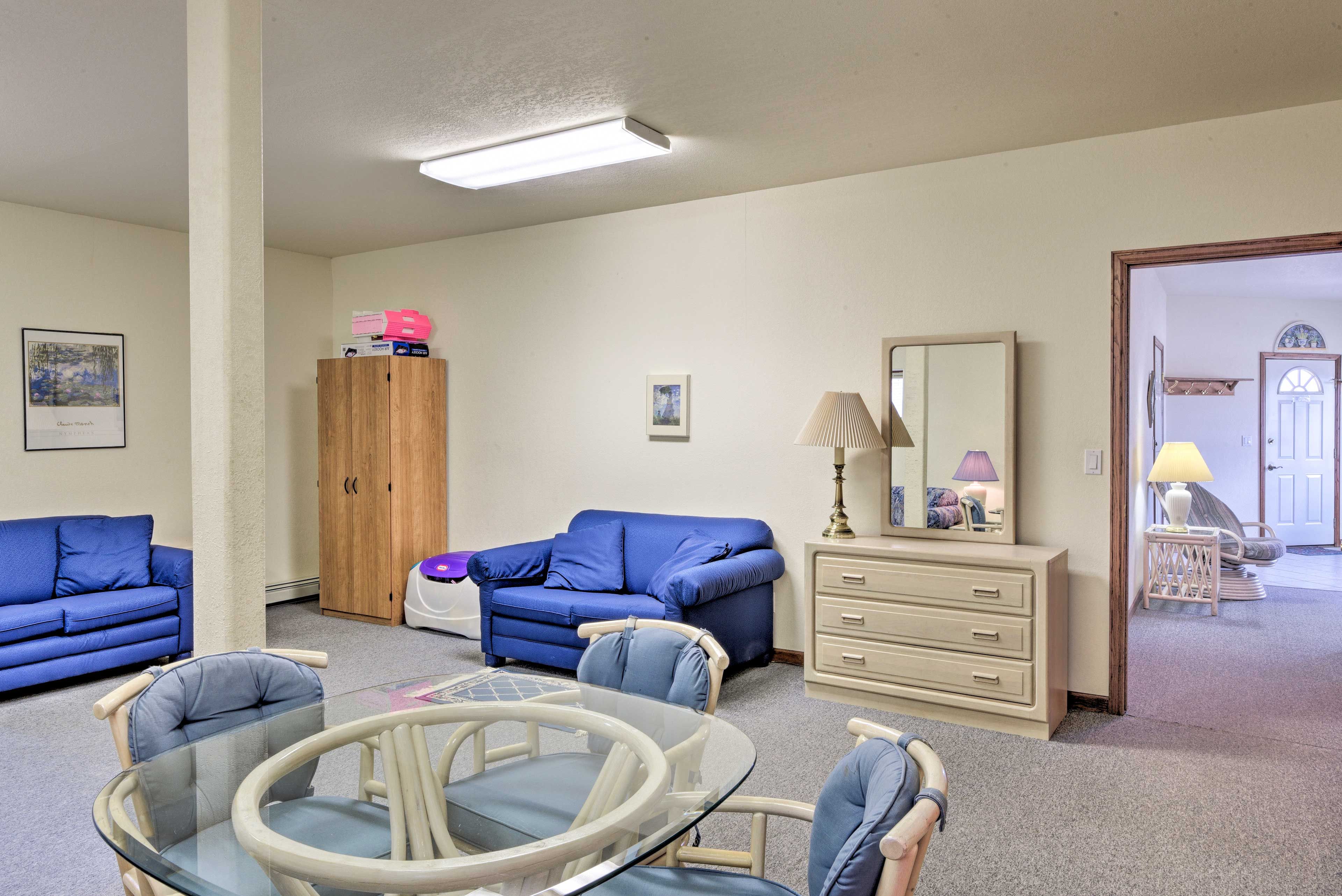 There are 3 sleeper sofas and a dresser.