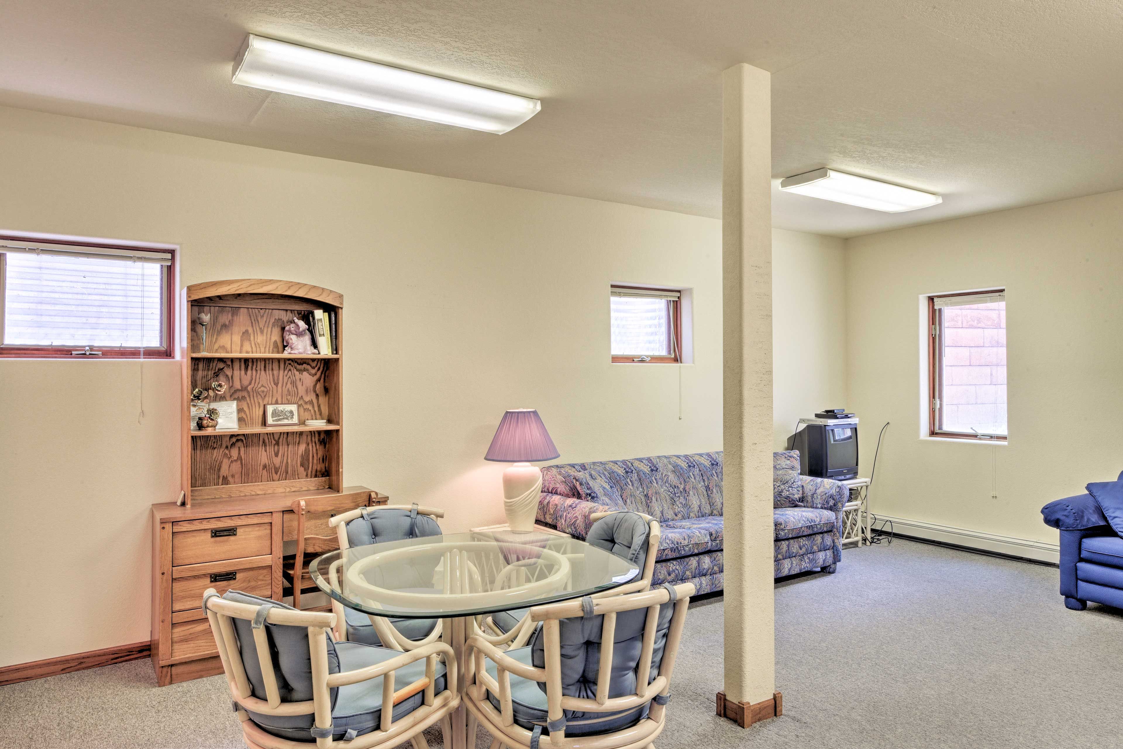 The rec room has a small dining table that doubles as the perfect card table.