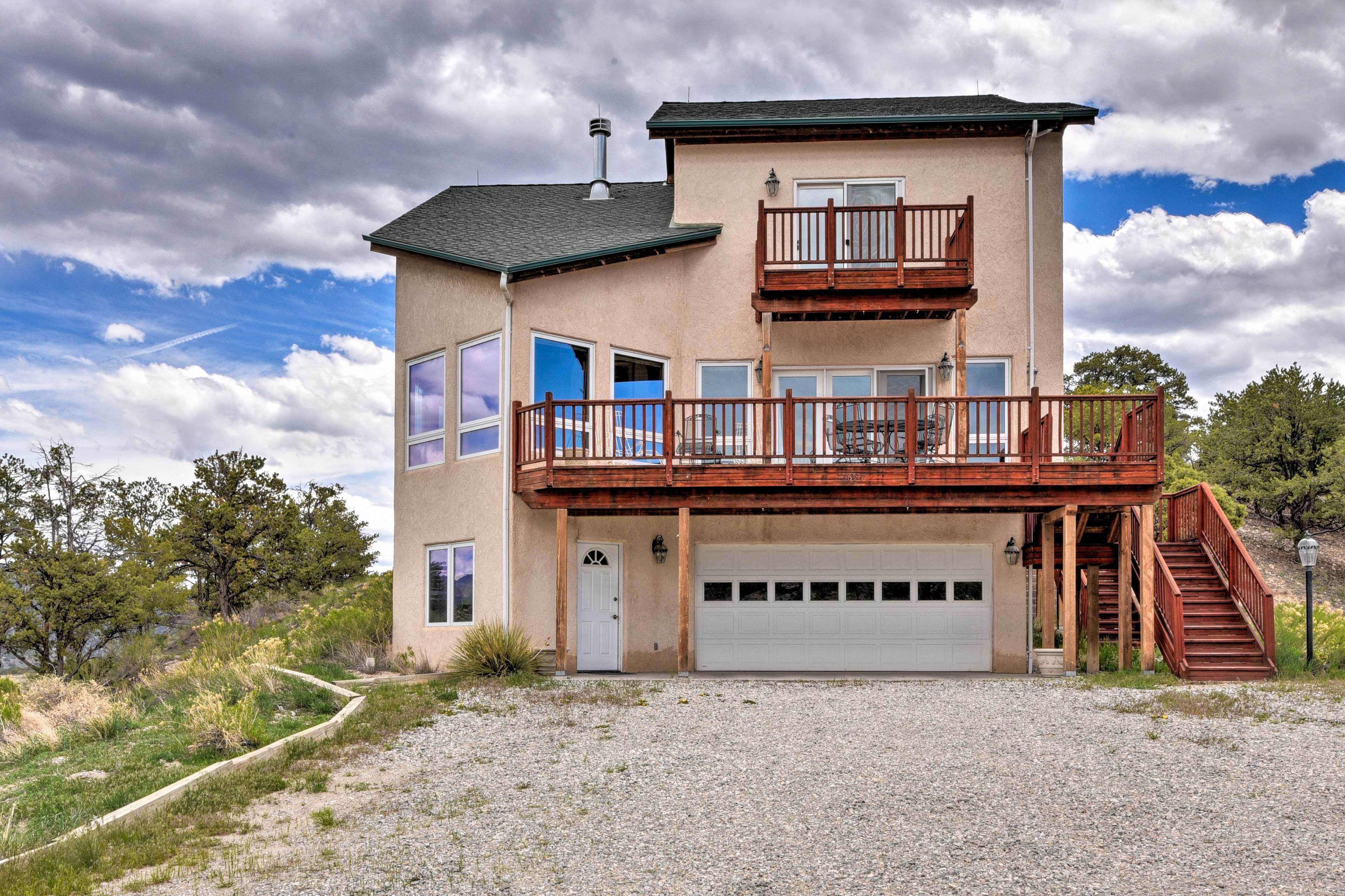 One car can park in the garage and up to 9 others can park in the driveway.