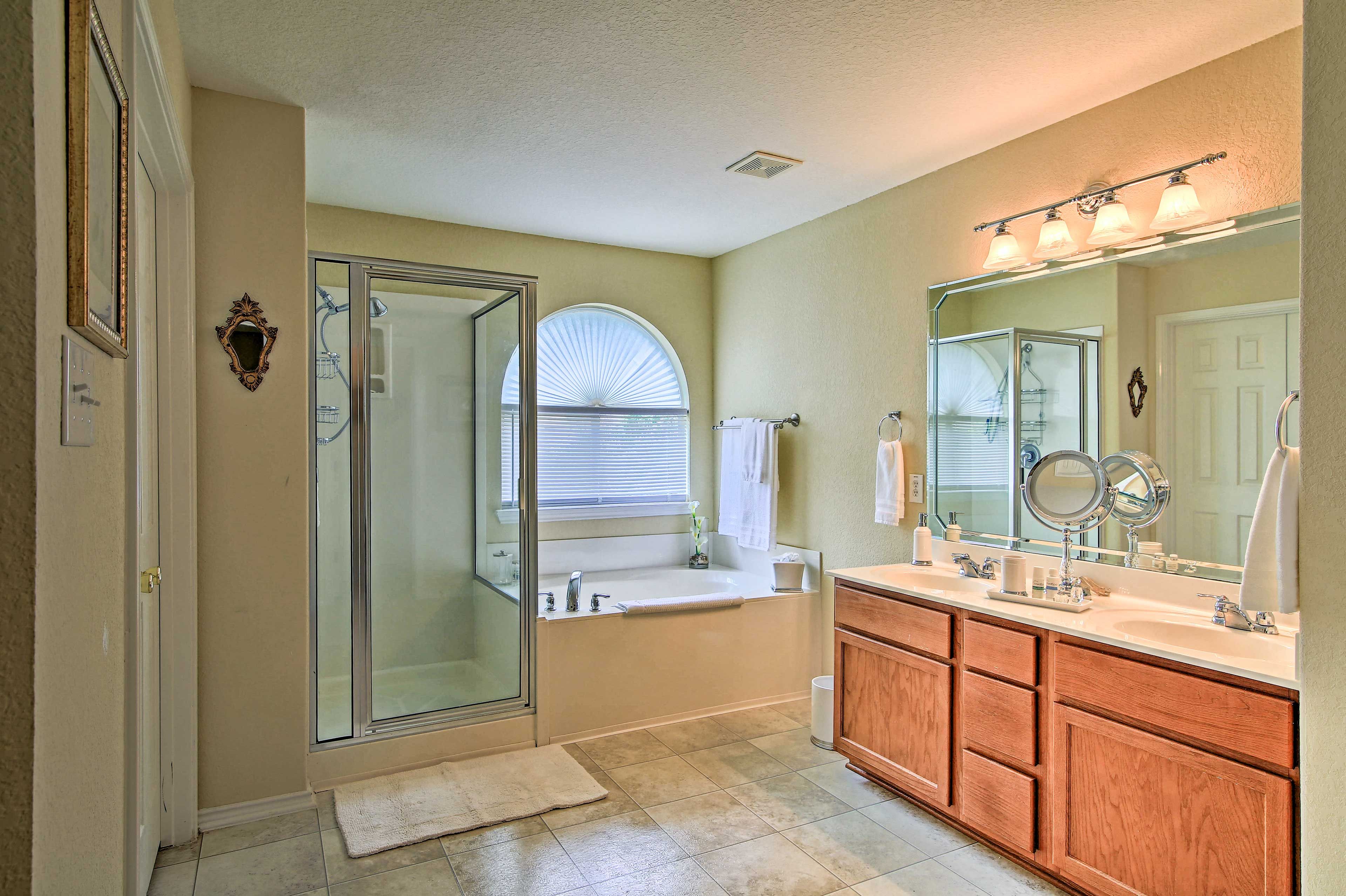 Take a relaxing soak in the large bathtub.