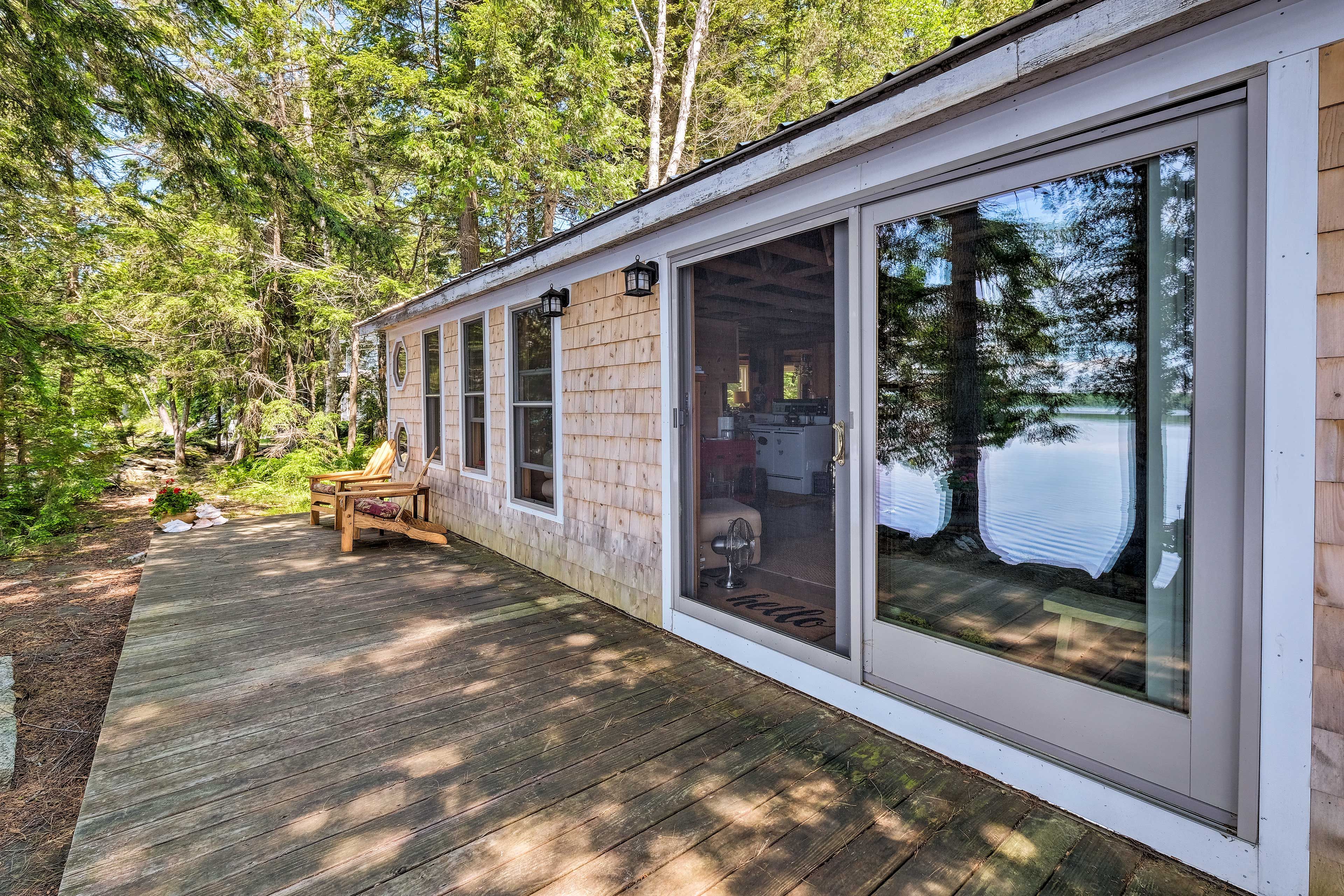 Sliding doors lead to the wraparound deck.