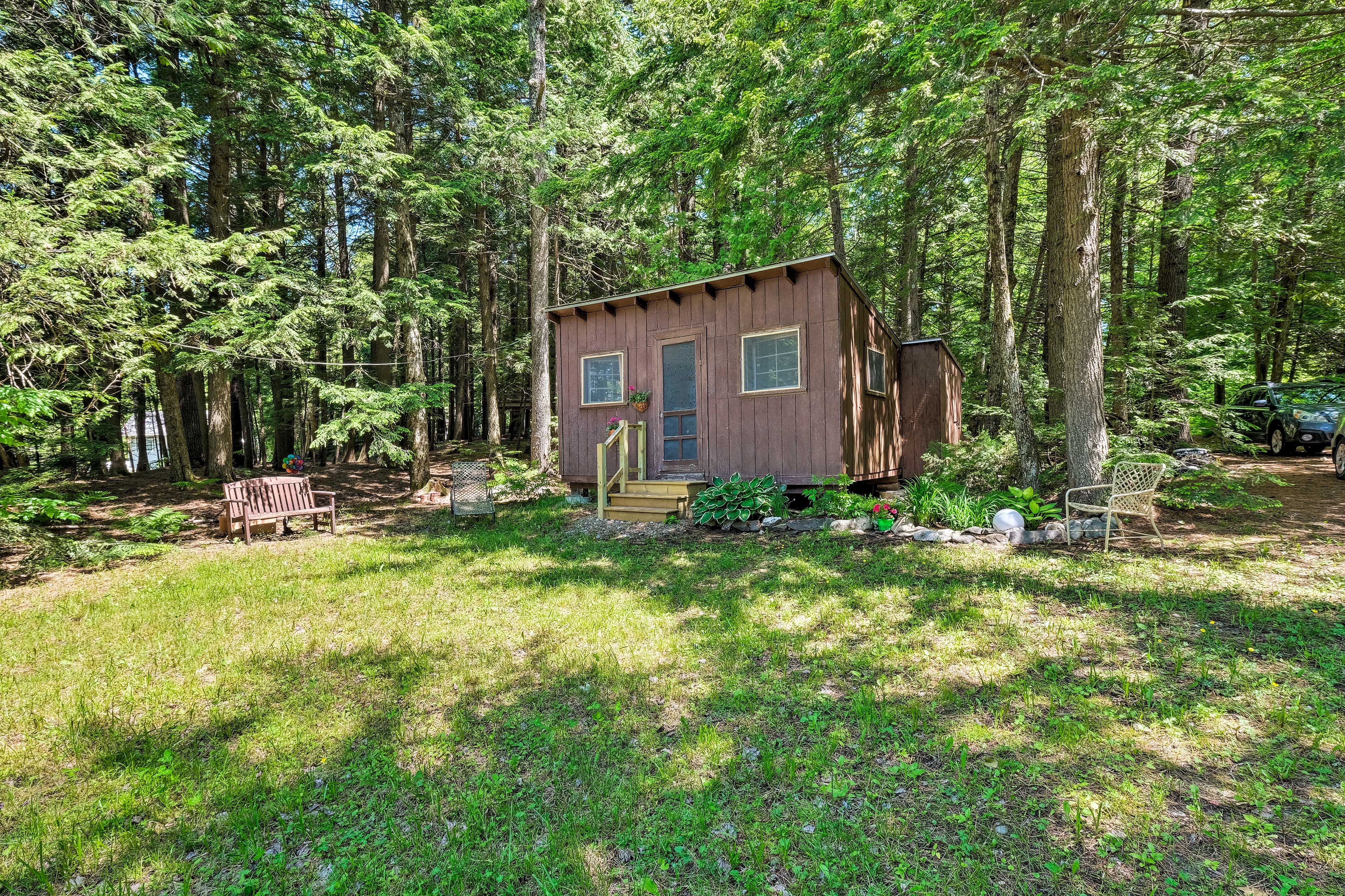 The spacious yard leads to the 3rd bedroom, detached for additional privacy.