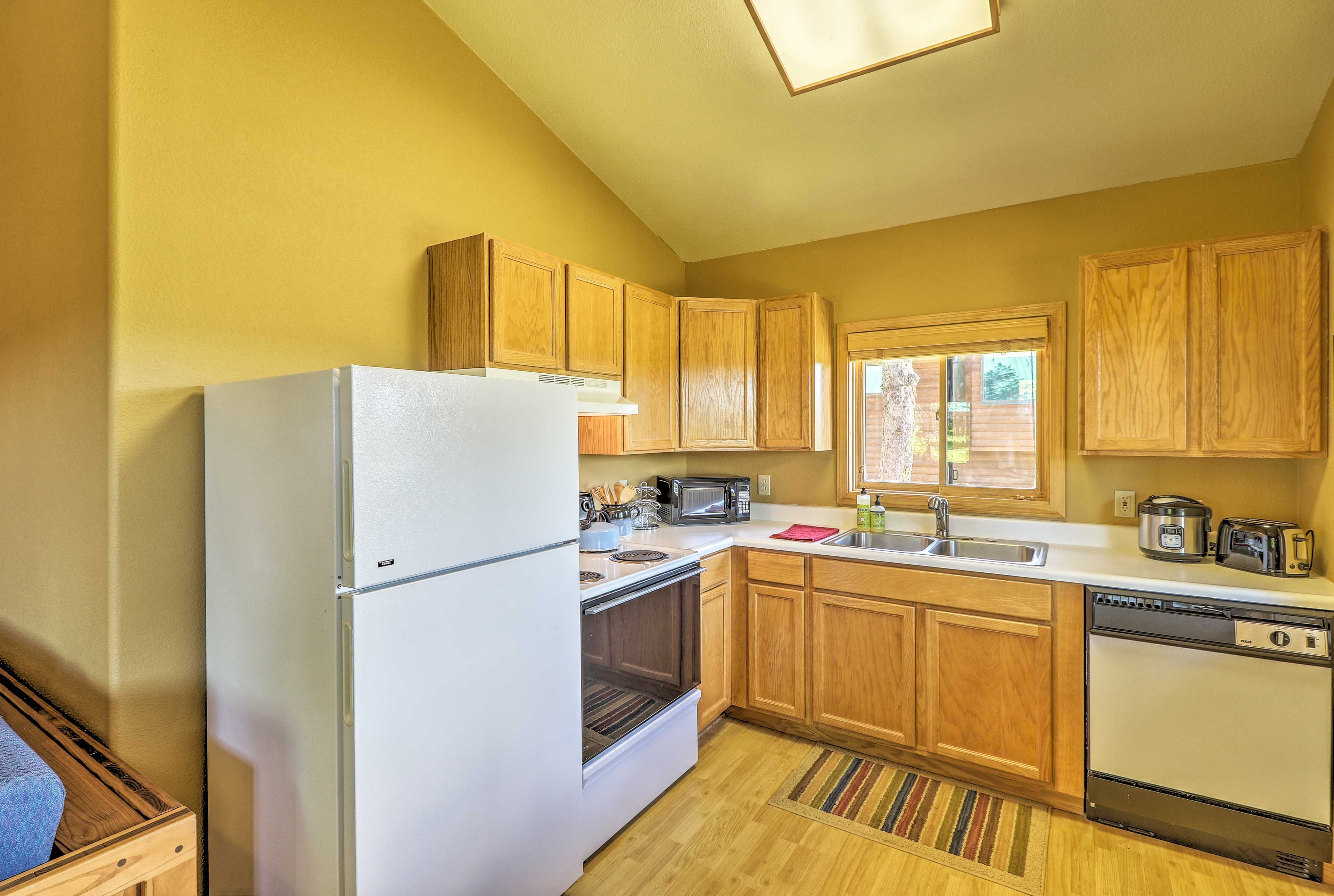 The kitchen is filled with all the cooking basics and spices.