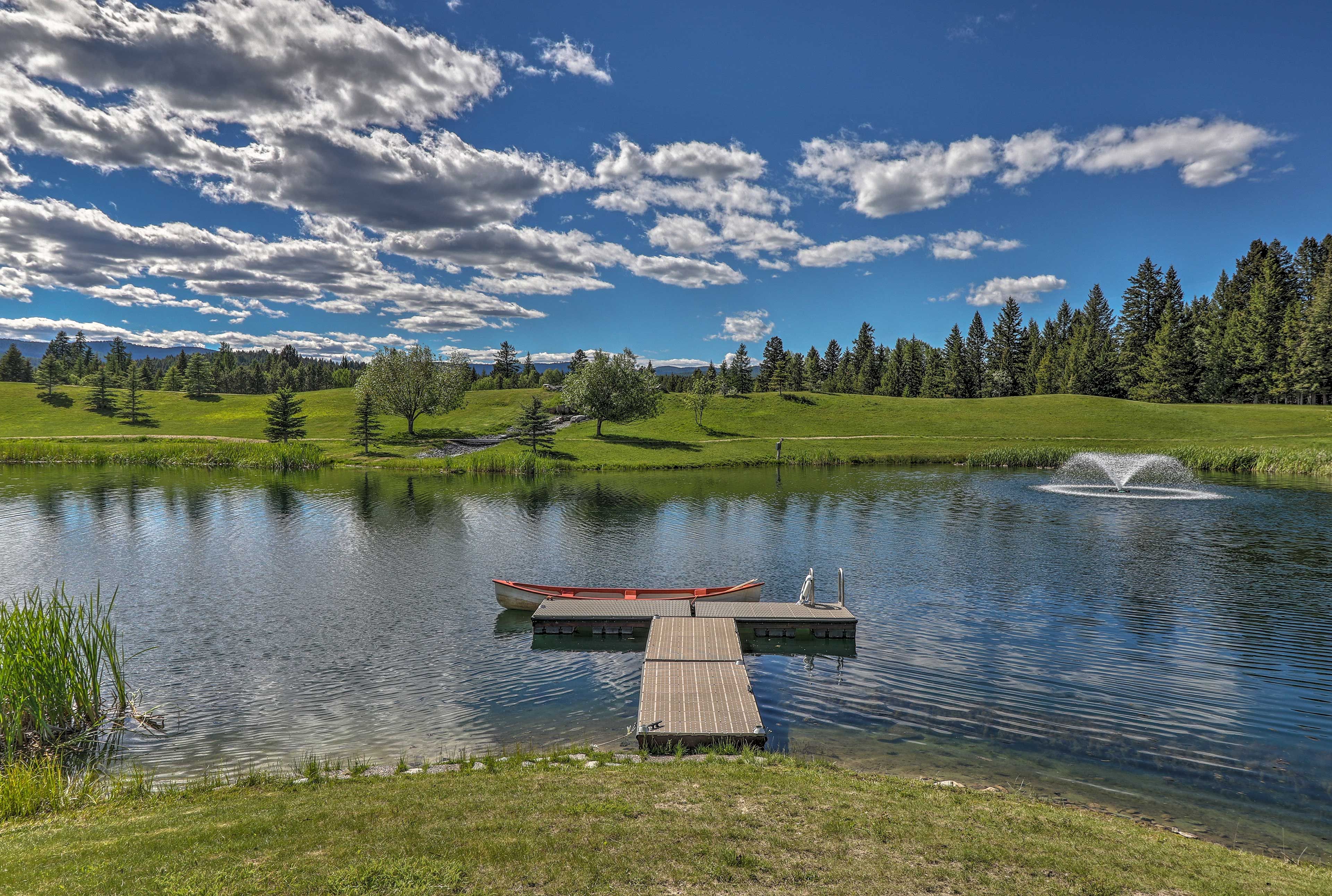 The property has a canoe, a lake, and stunning mountain views.