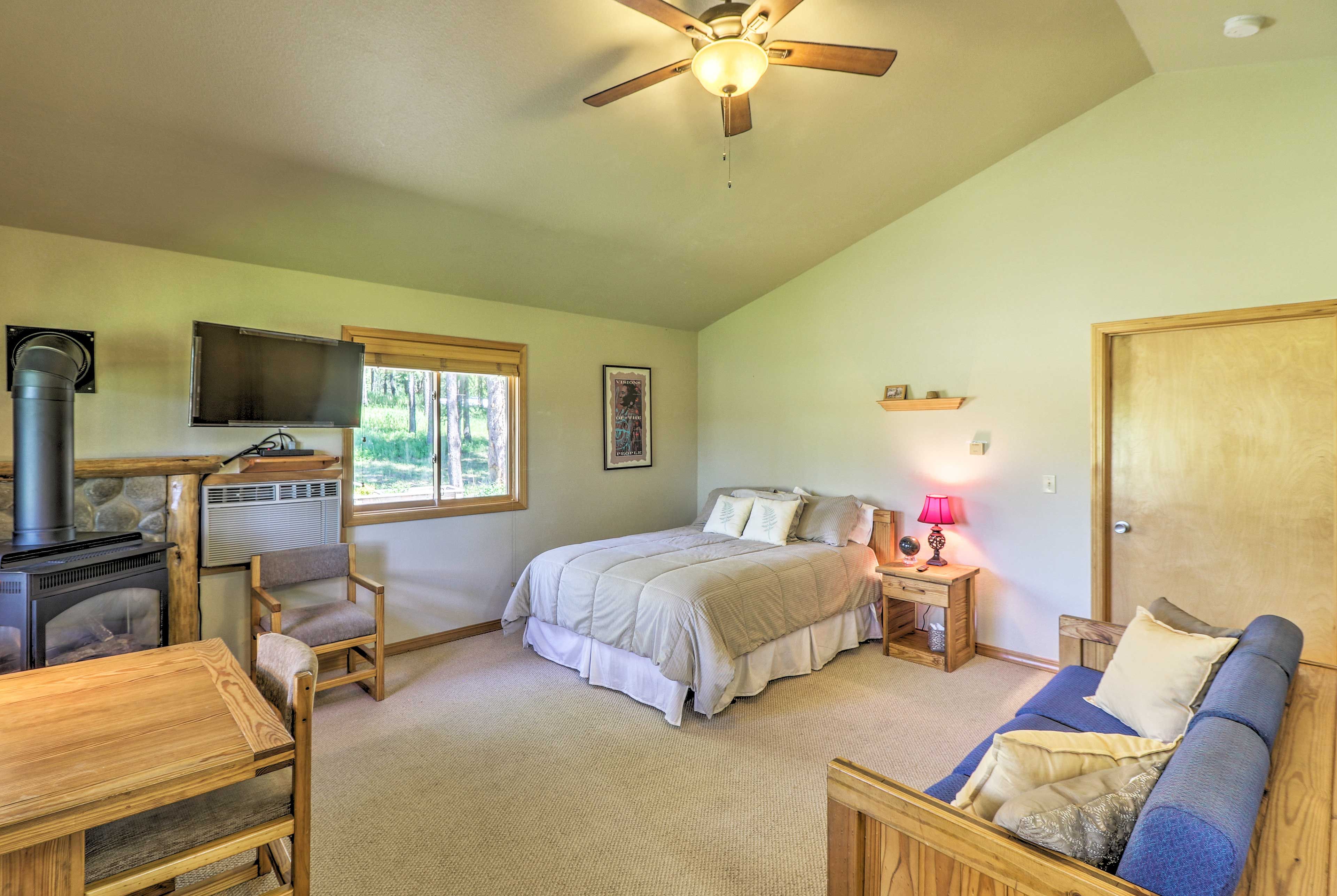 Relax on the queen-sized bed and watch the flat-screen cable TV.