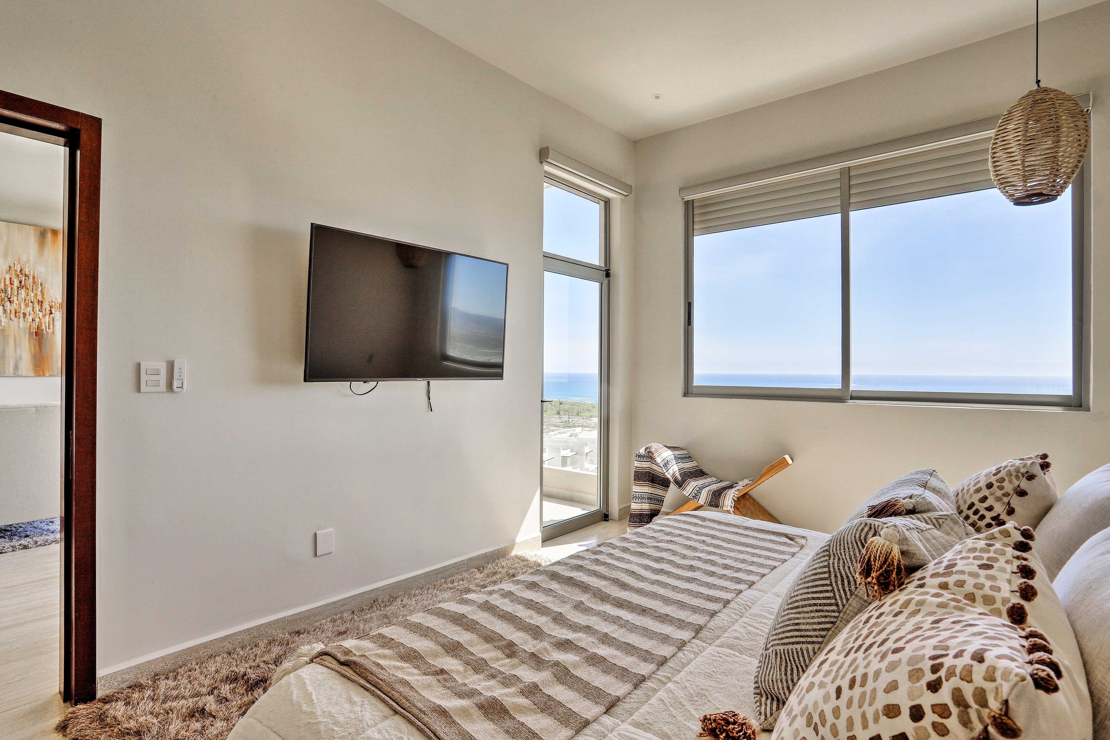 Watch the morning news on the flat-screen Smart TV from the comfort of your bed.