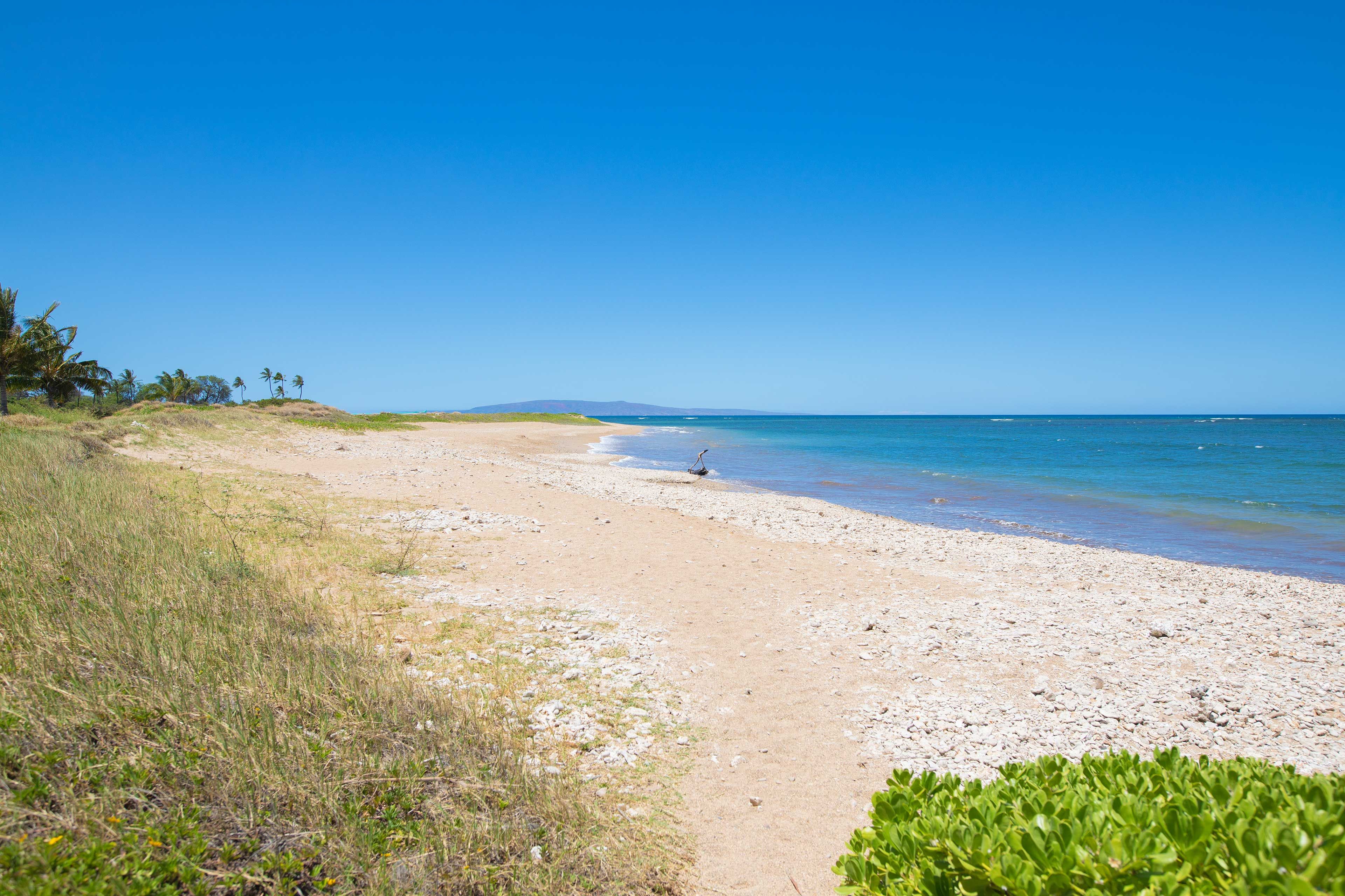 Start each morning with a stroll down the beach.