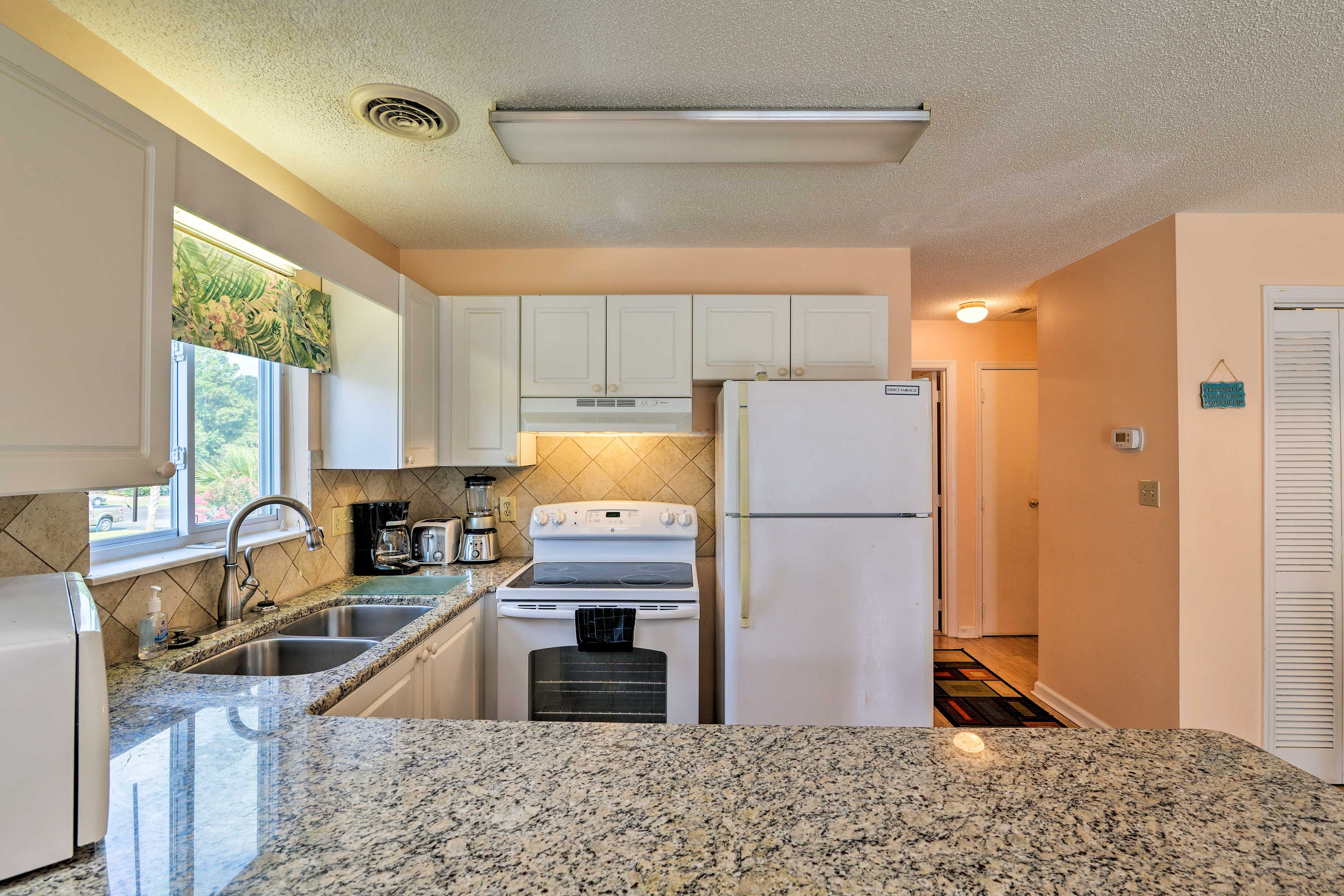 The kitchen is fully equipped with basic cooking essentials.