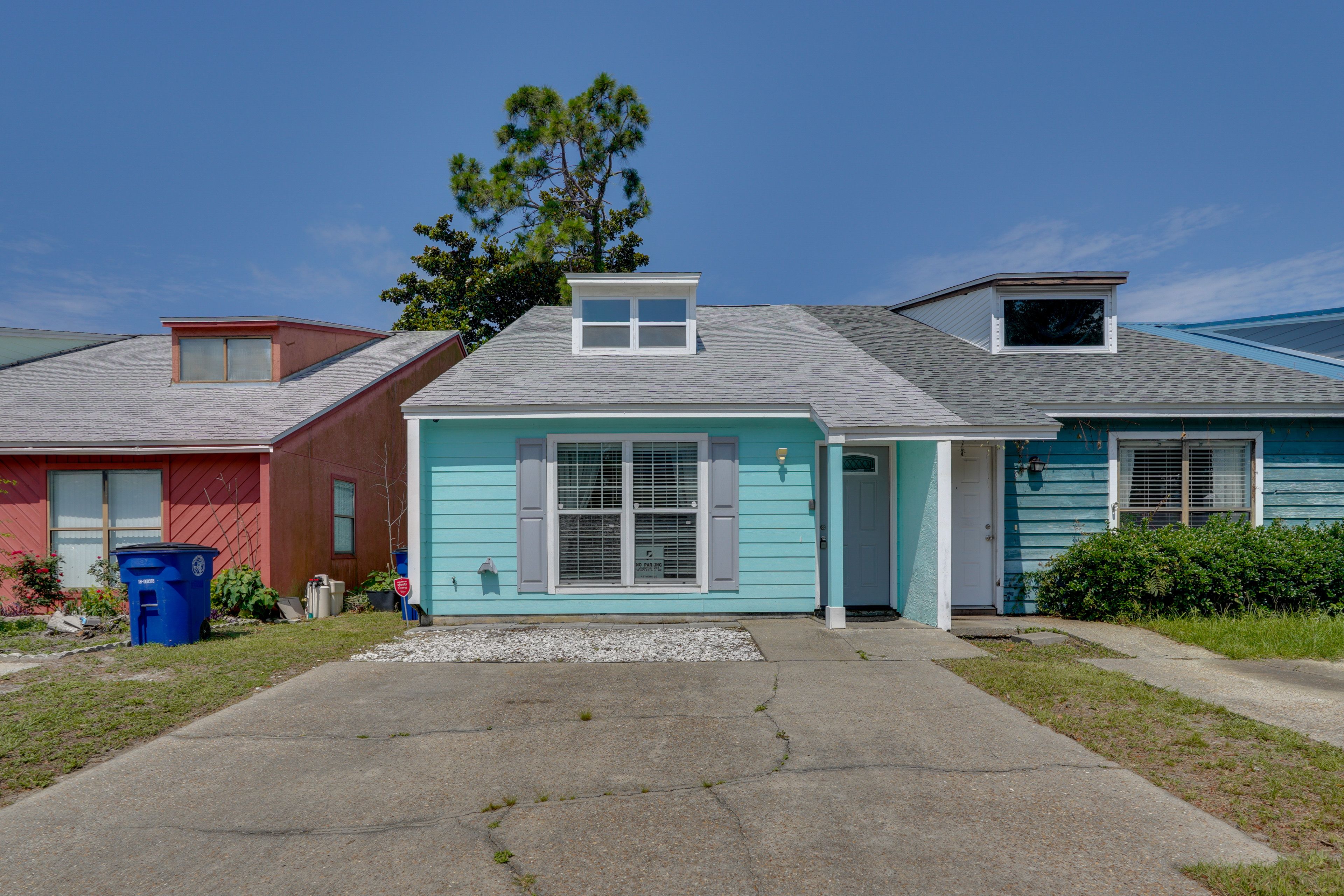 Townhouse Exterior | Driveway (2 Vehicles) | Private Yard | Gas Grill