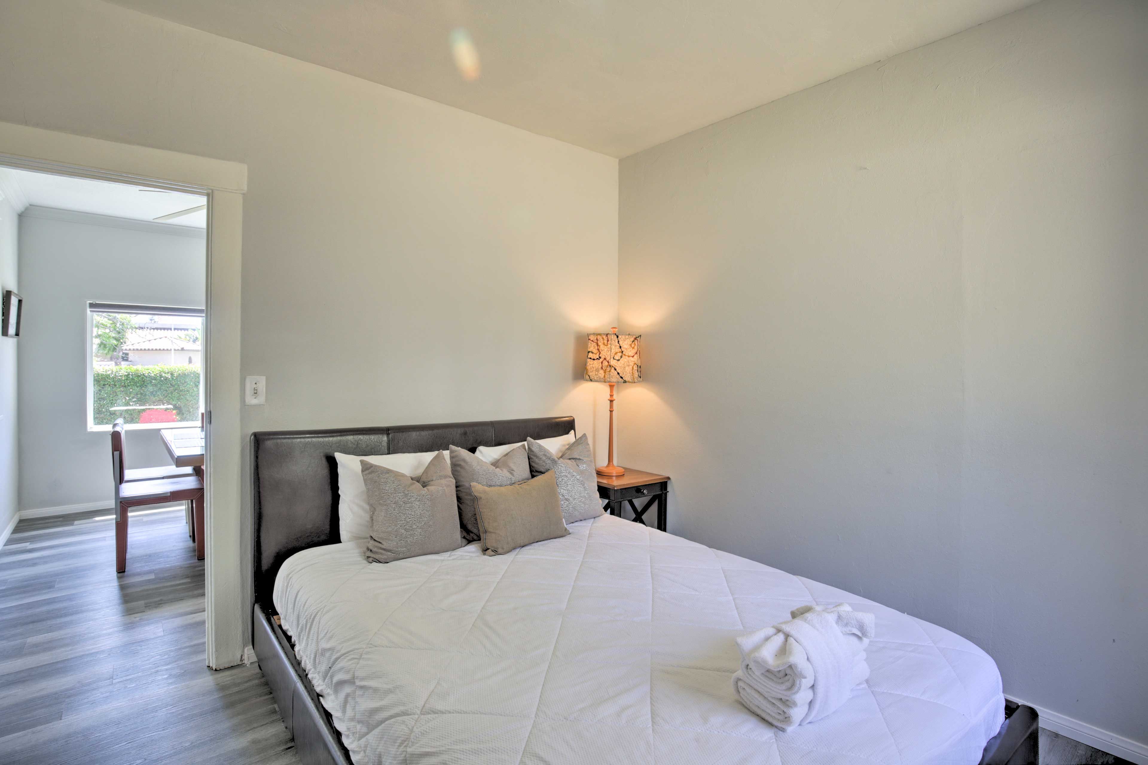 The second bedroom hosts a queen-sized bed.