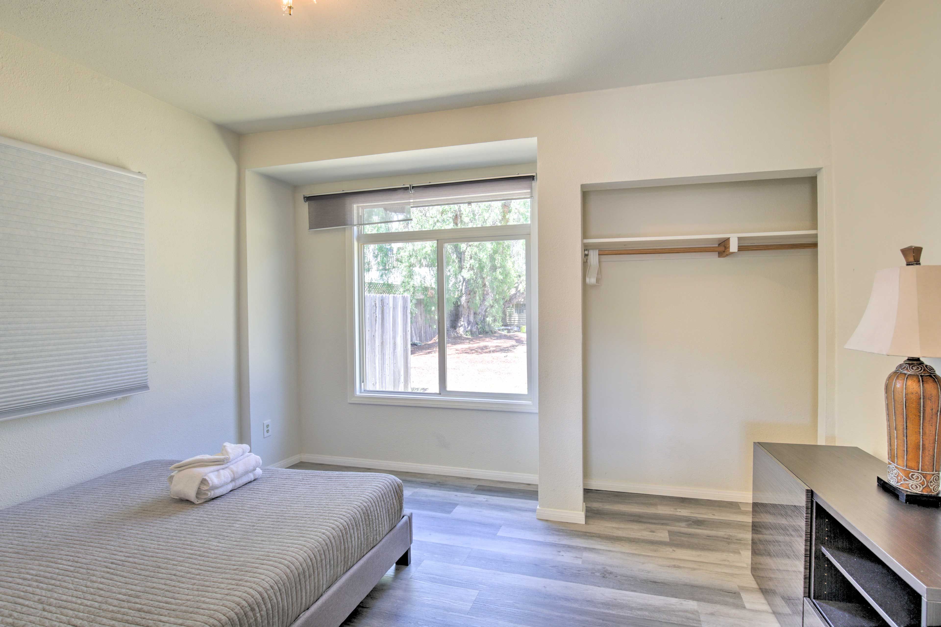 This bright & airy room features a queen bed.
