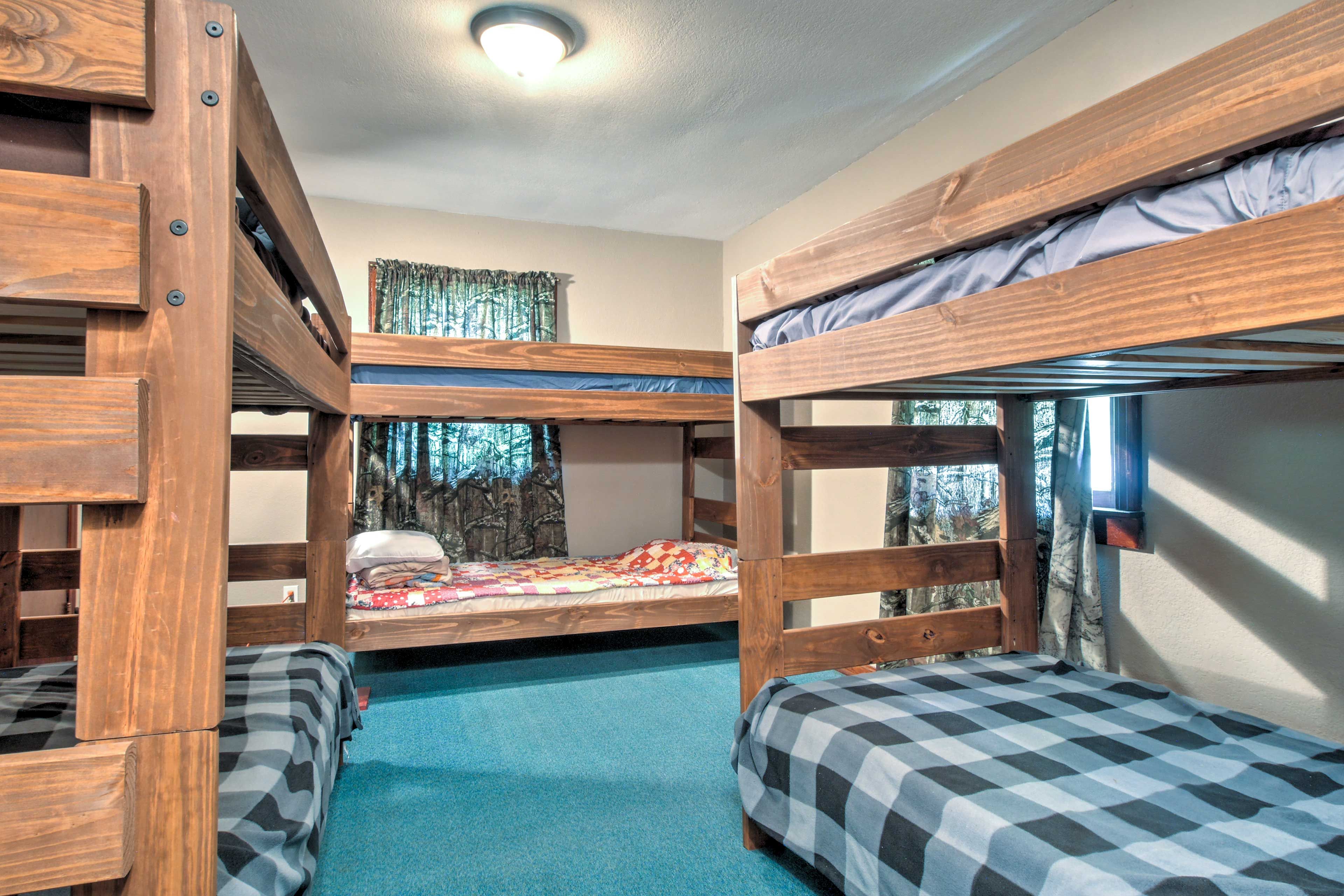 Six guests can share a room with these 3 twin-over-twin bunk beds.