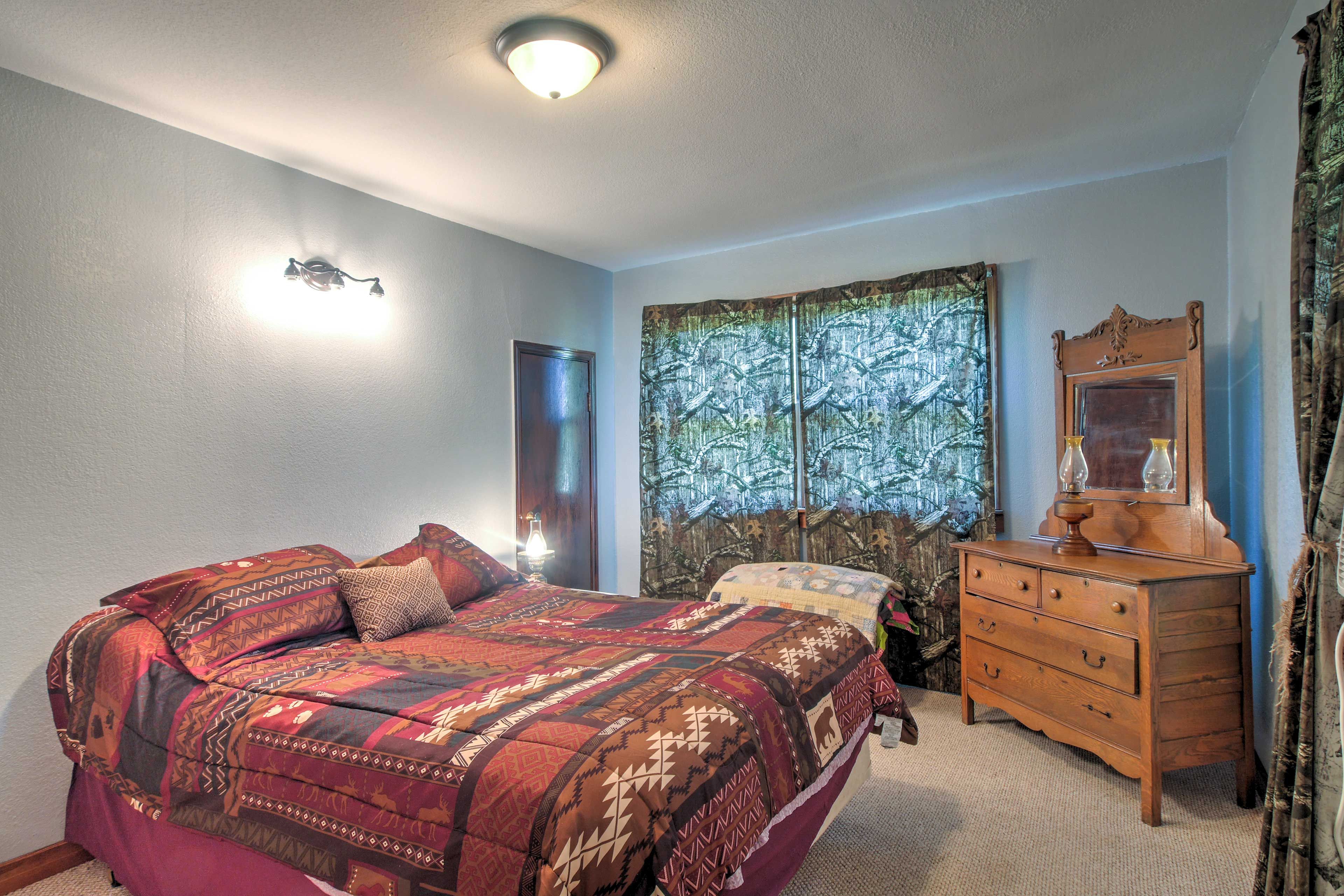 Rest and recuperate in the bedroom featuring a cozy queen and twin bed.